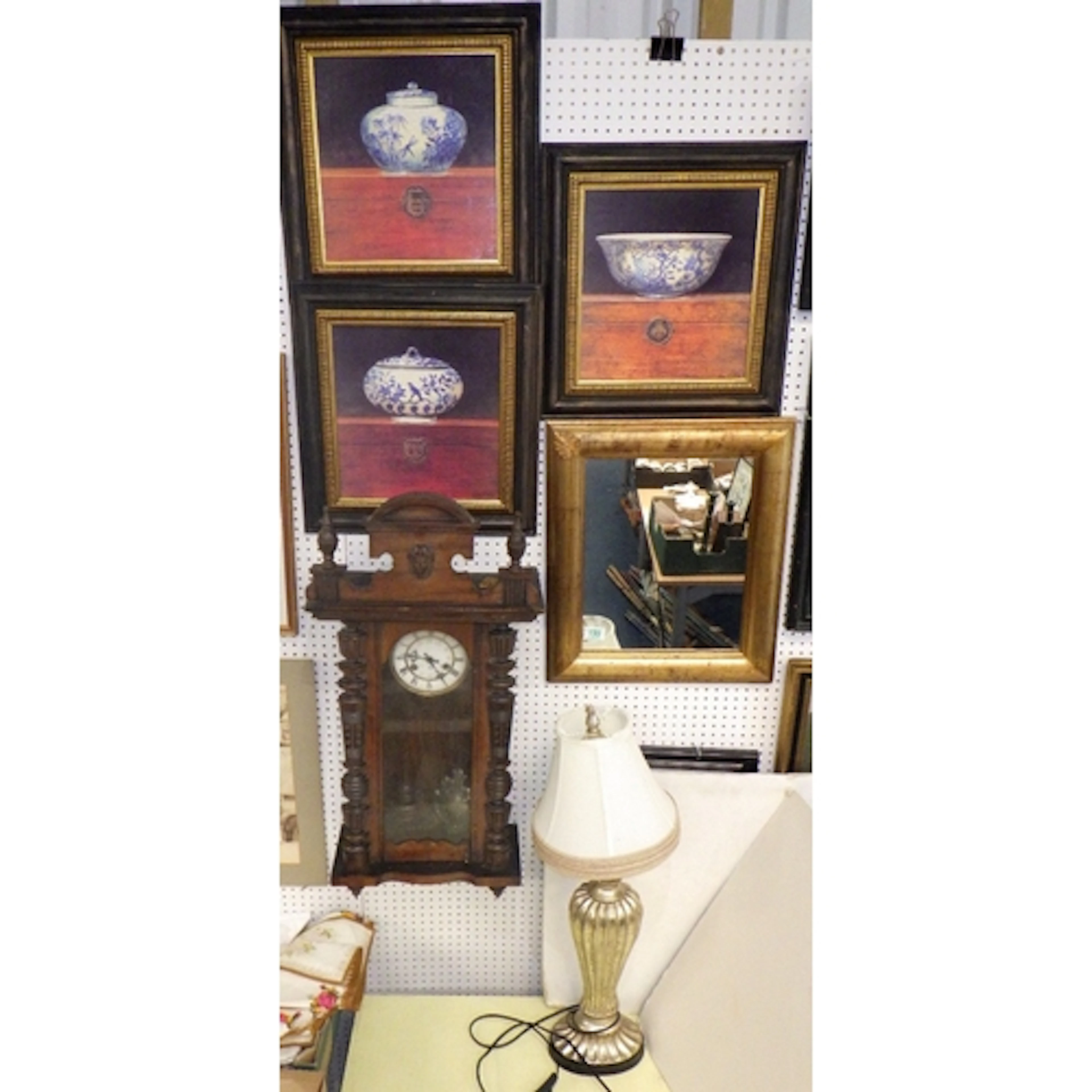 A 19thC wall clock, modern lamp, three prints and a mirror (...