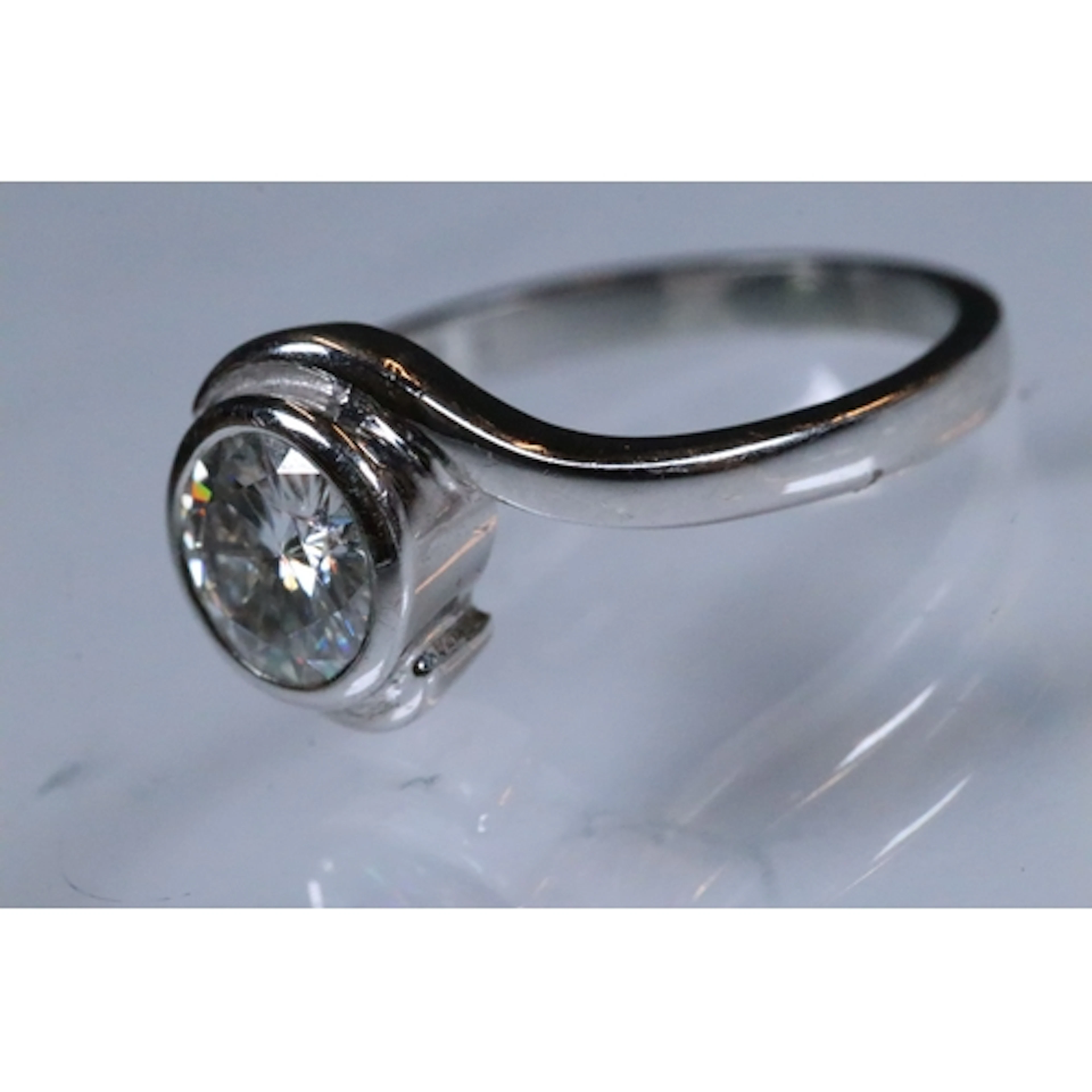 18ct white gold and synthetic moissanite ring. The ring bein...
