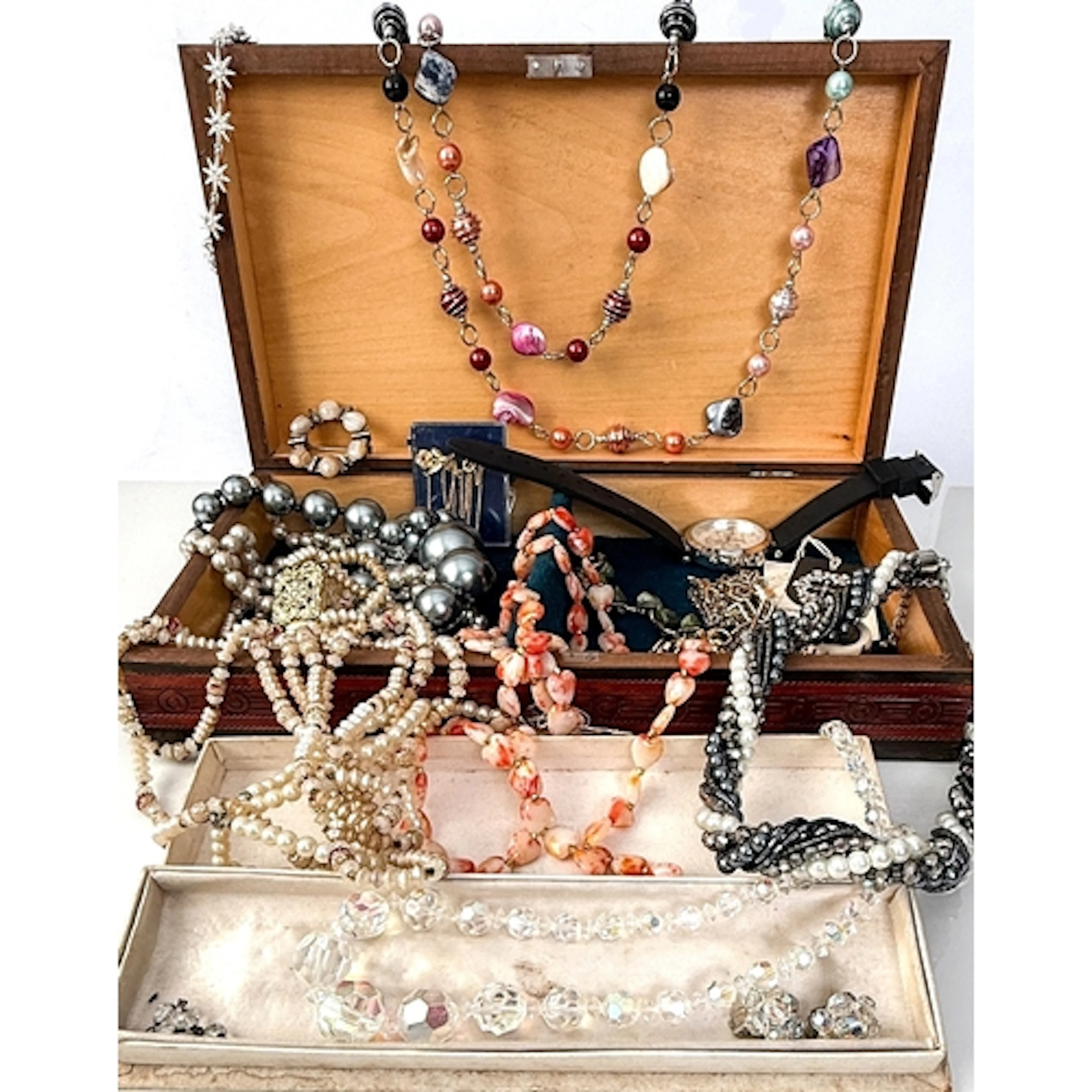 A box containing various vintage costume jewellery, together...