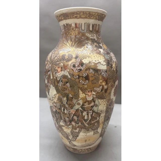 A Japanese satsuma vase decorated with battling samurai. Hei...