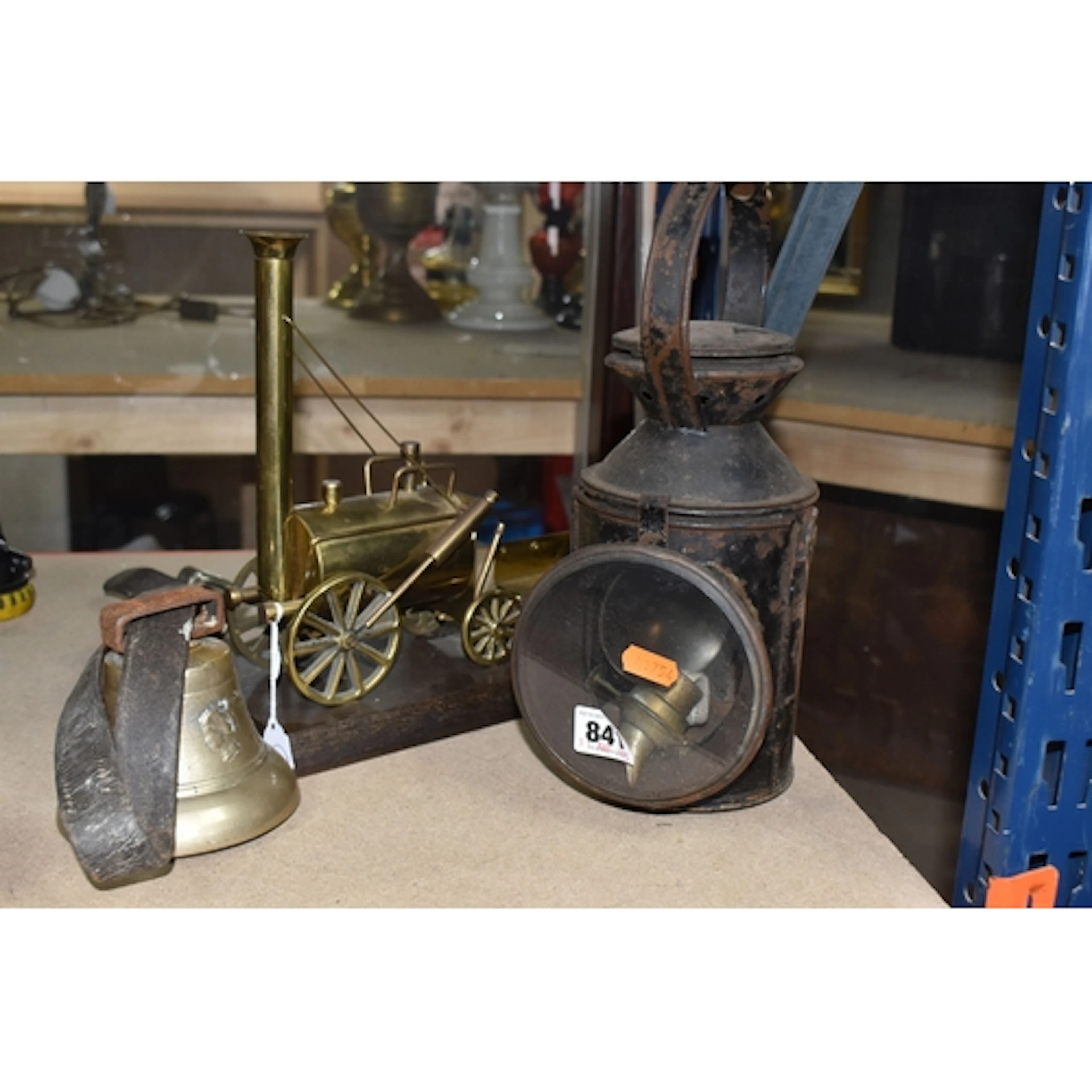 A TRAIN LANTERN, MODEL, AND A BELL comprising a metal carria...