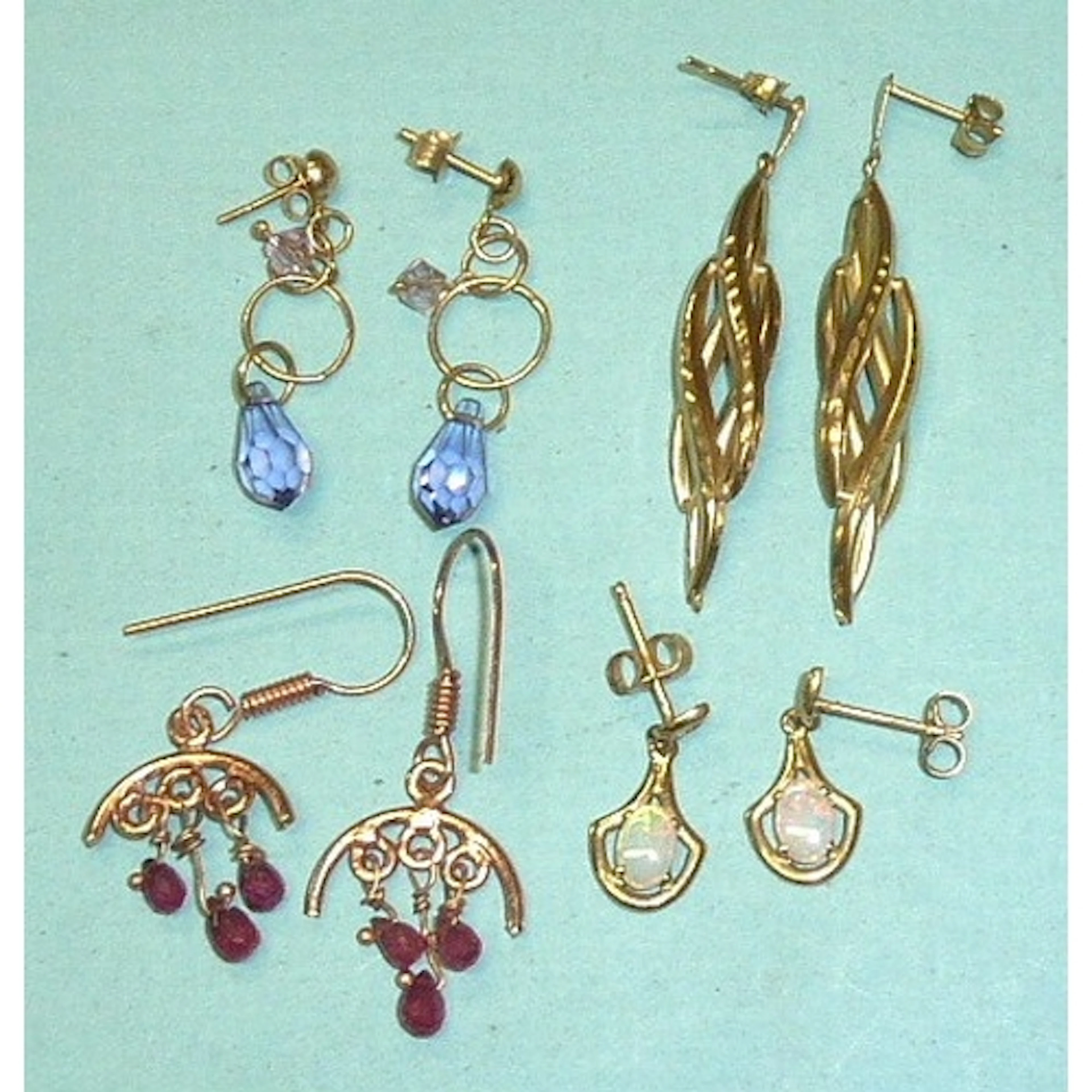 A pair of 9ct gold earrings set opals, 1.4g, a pair of unmar...