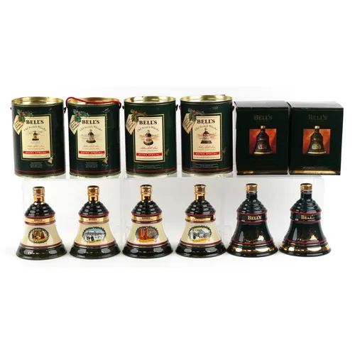 Six Bell's Christmas Edition whisky decanters comprising 198...