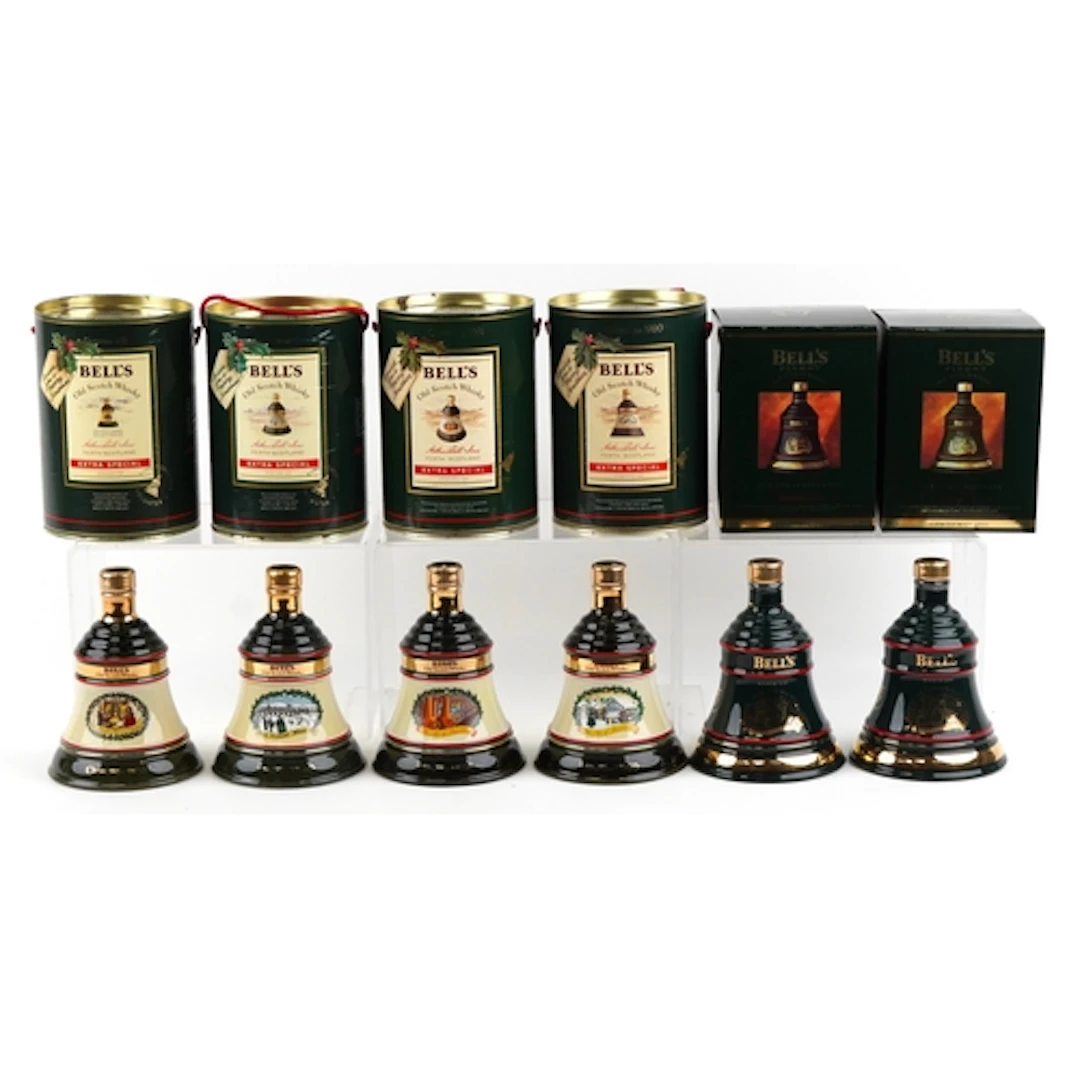 Six Bell's Christmas Edition whisky decanters comprising 198...