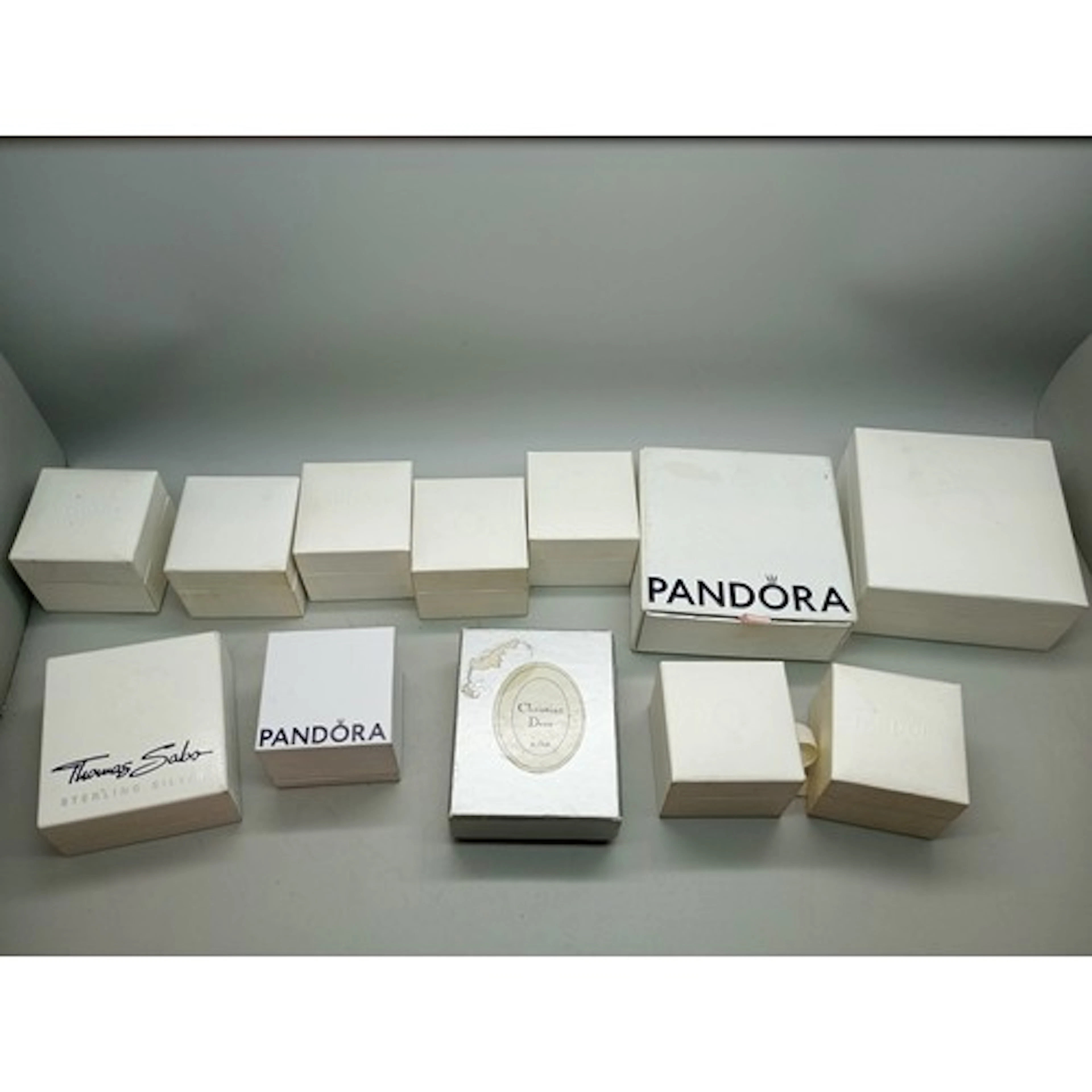 A collection of boxes including Pandora, Christian Dior and ...