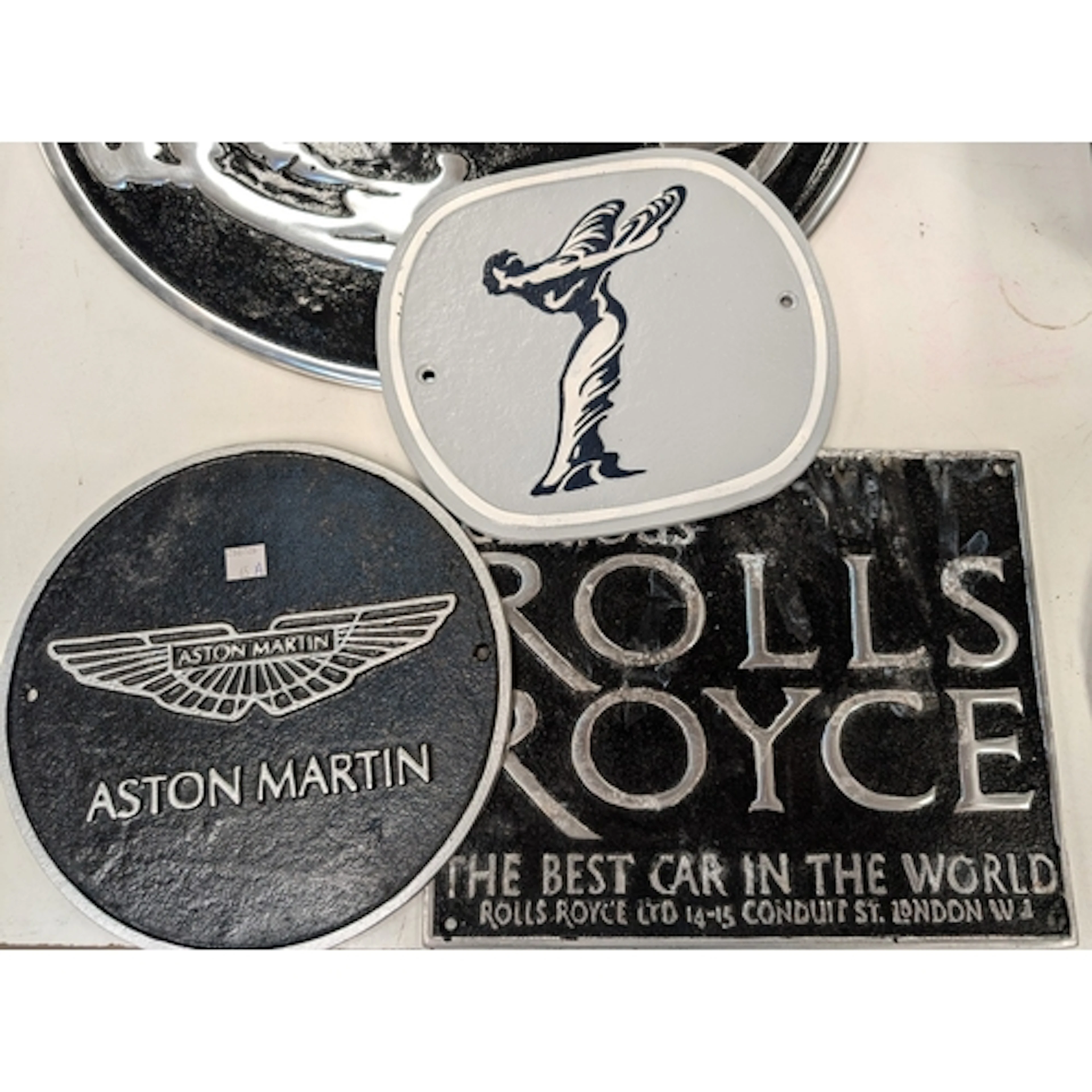 2 cast iron wall signs including Spirit of Ecstasy and Aston...