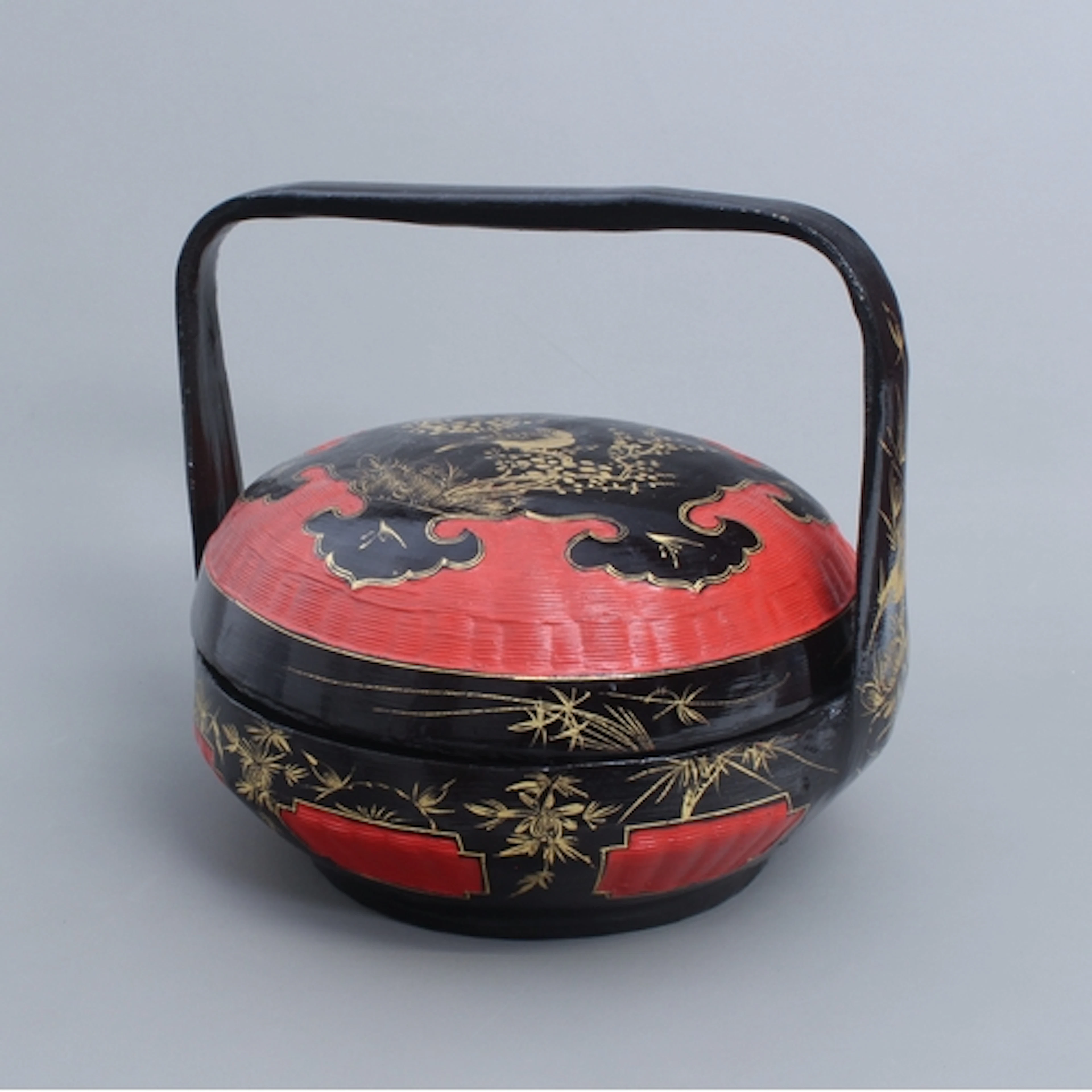 A traditional Peranakan Chinese wedding basket - of circular...