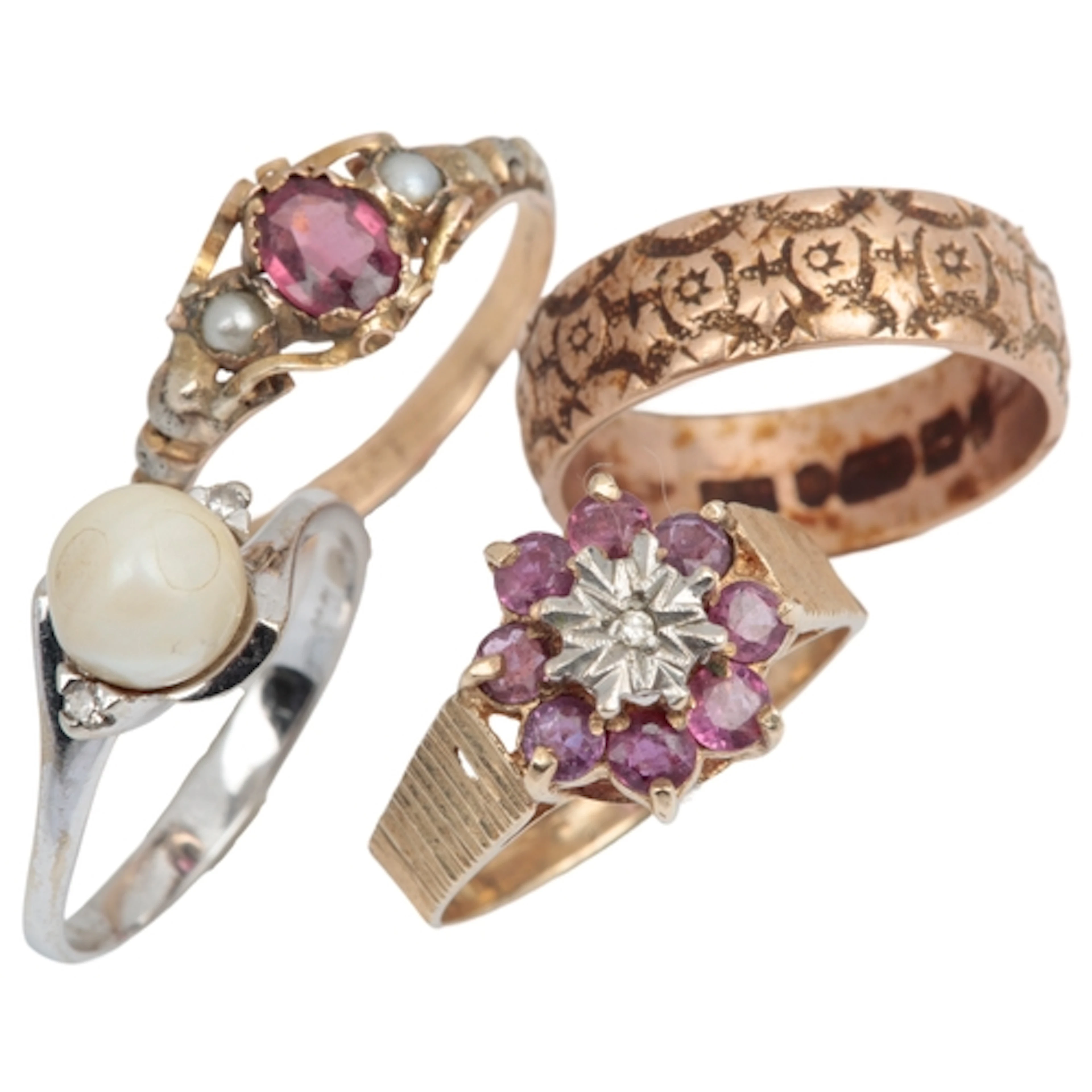 A group of four rings, comprising: a floral wedding band and...