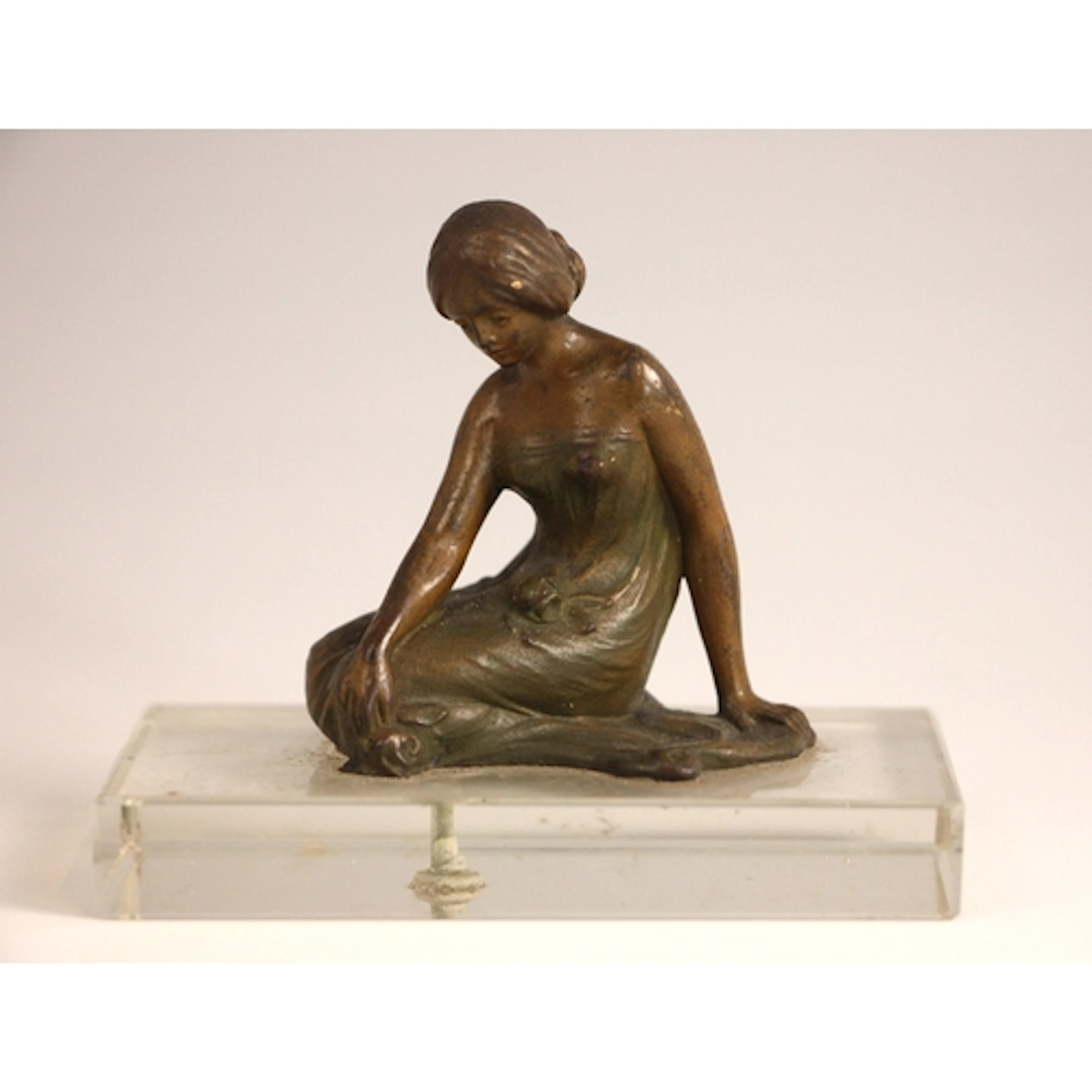 A patinated bronze Art Nouveau style figure of small proport...