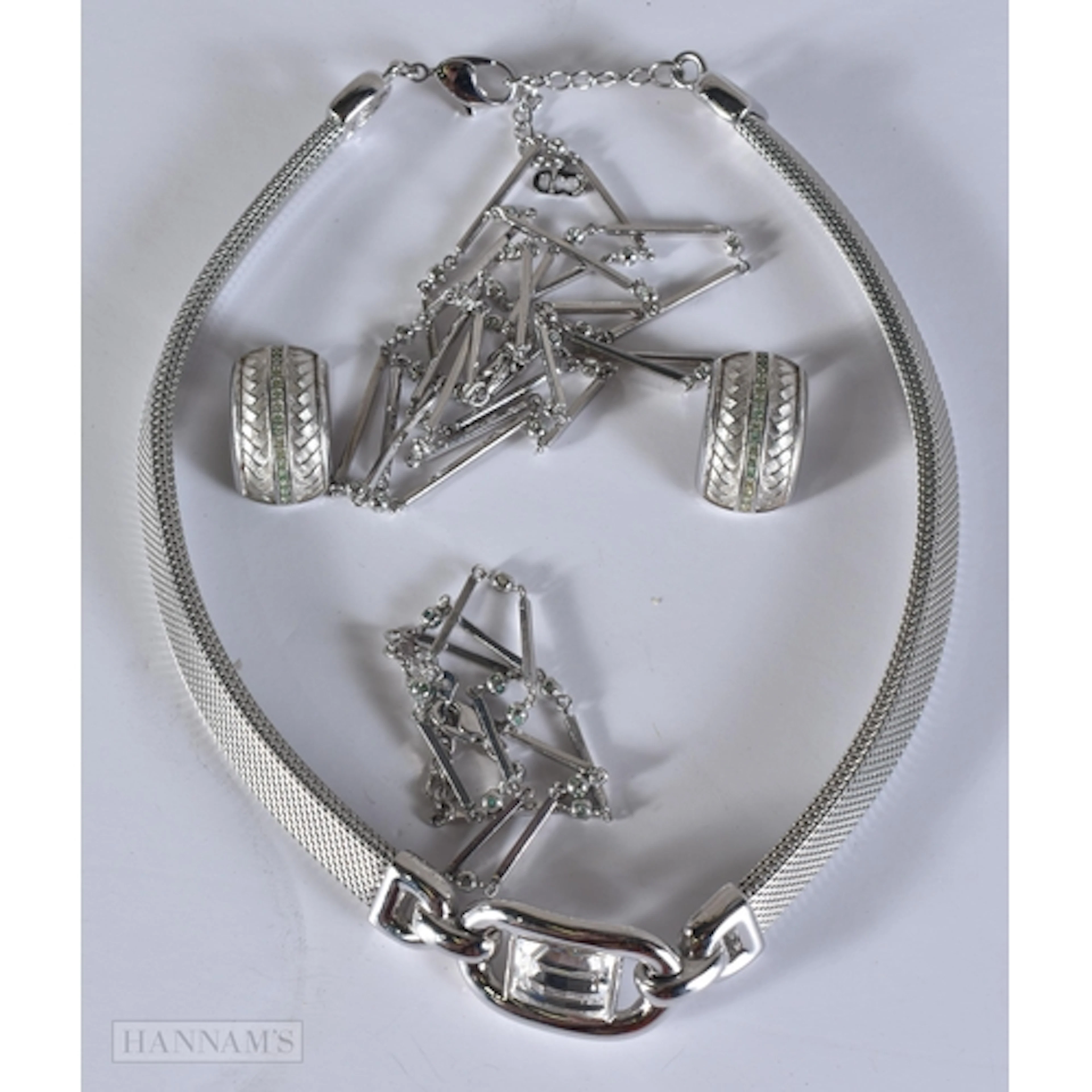Three Christian Dior Silver Tone Necklaces and a Pair of Cli...