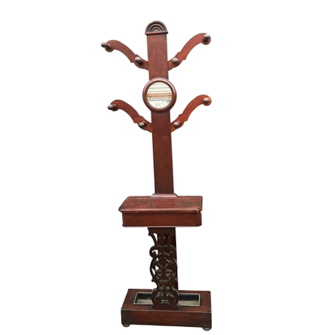A VICTORIAN STYLE MAHOGANY COAT TREE With circular mirror. 2...