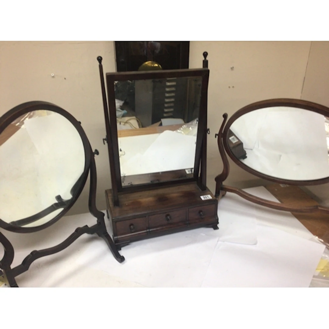 A George III mahogany dressing mirror of rectangular shape a...