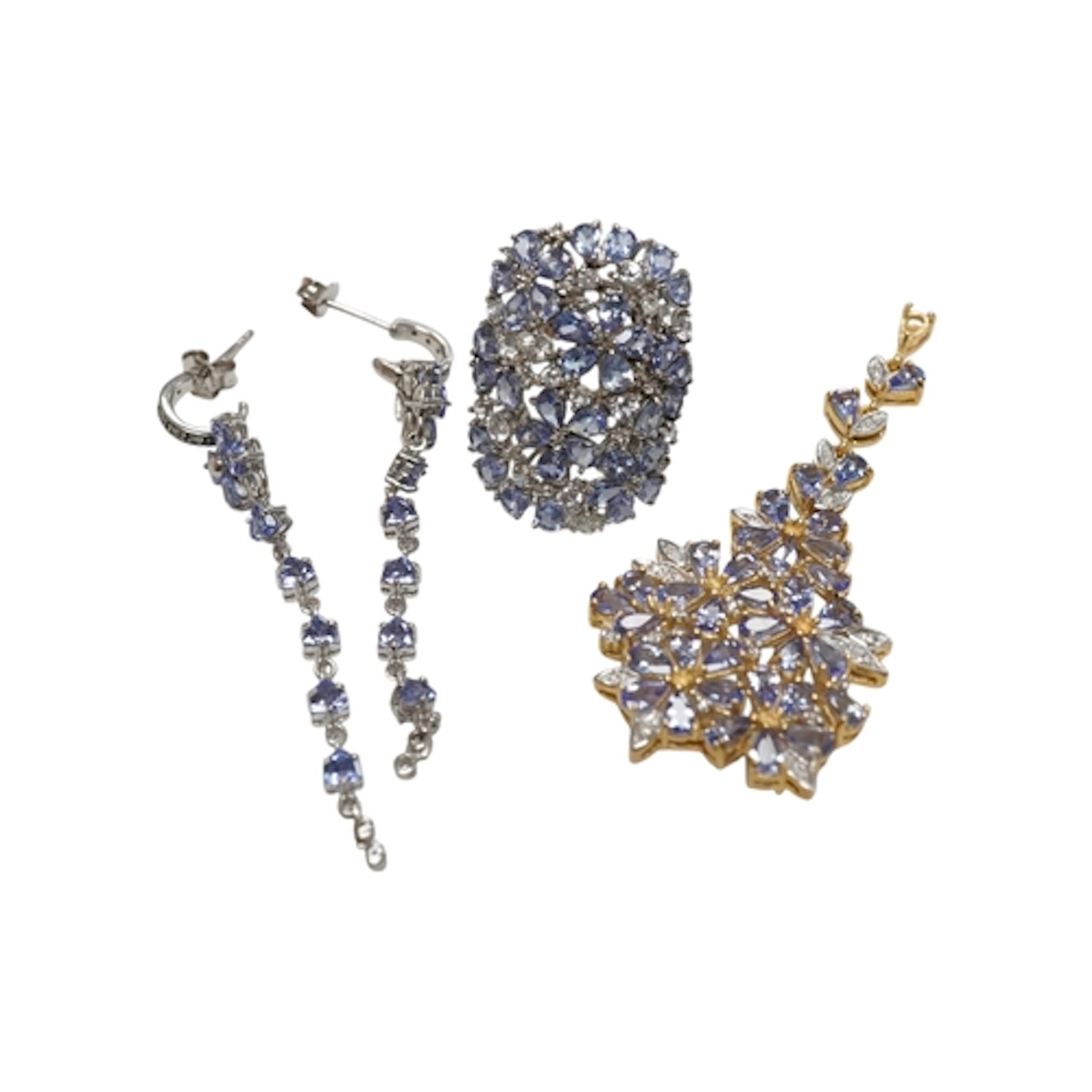A collection of tanzanite jewels, comprising: an articulated...