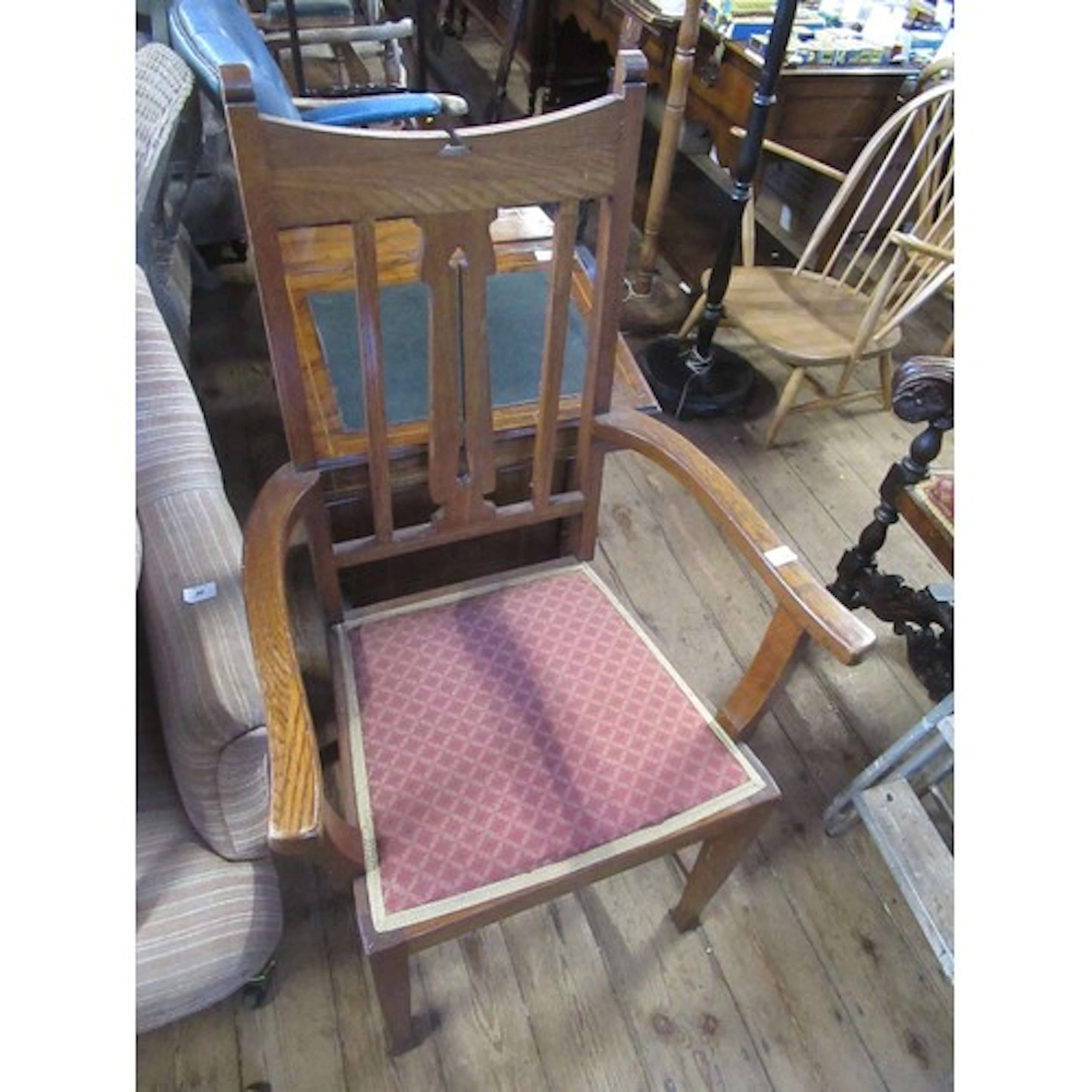 An Art Nouveau style open arm chair