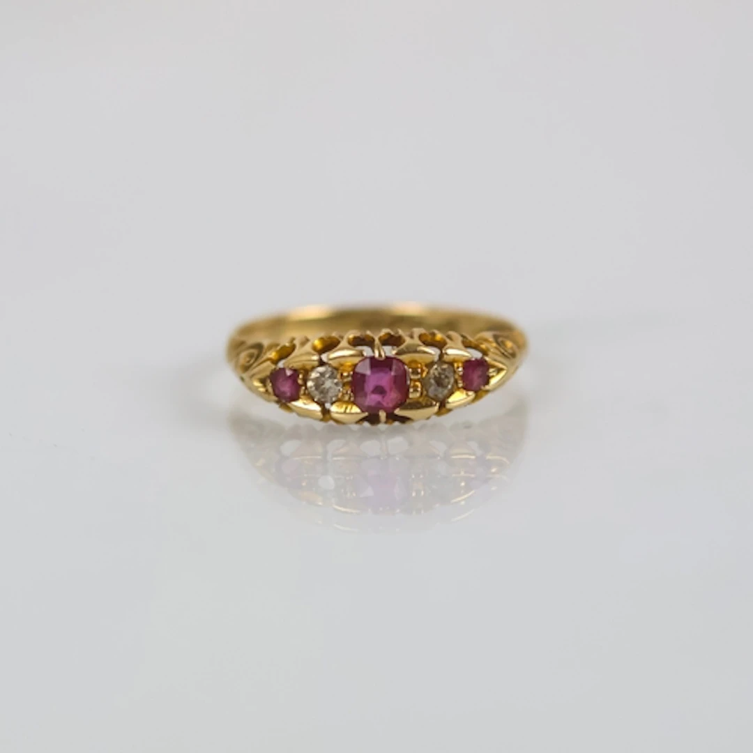 An early 20th century ruby and diamond ring, the central rub...