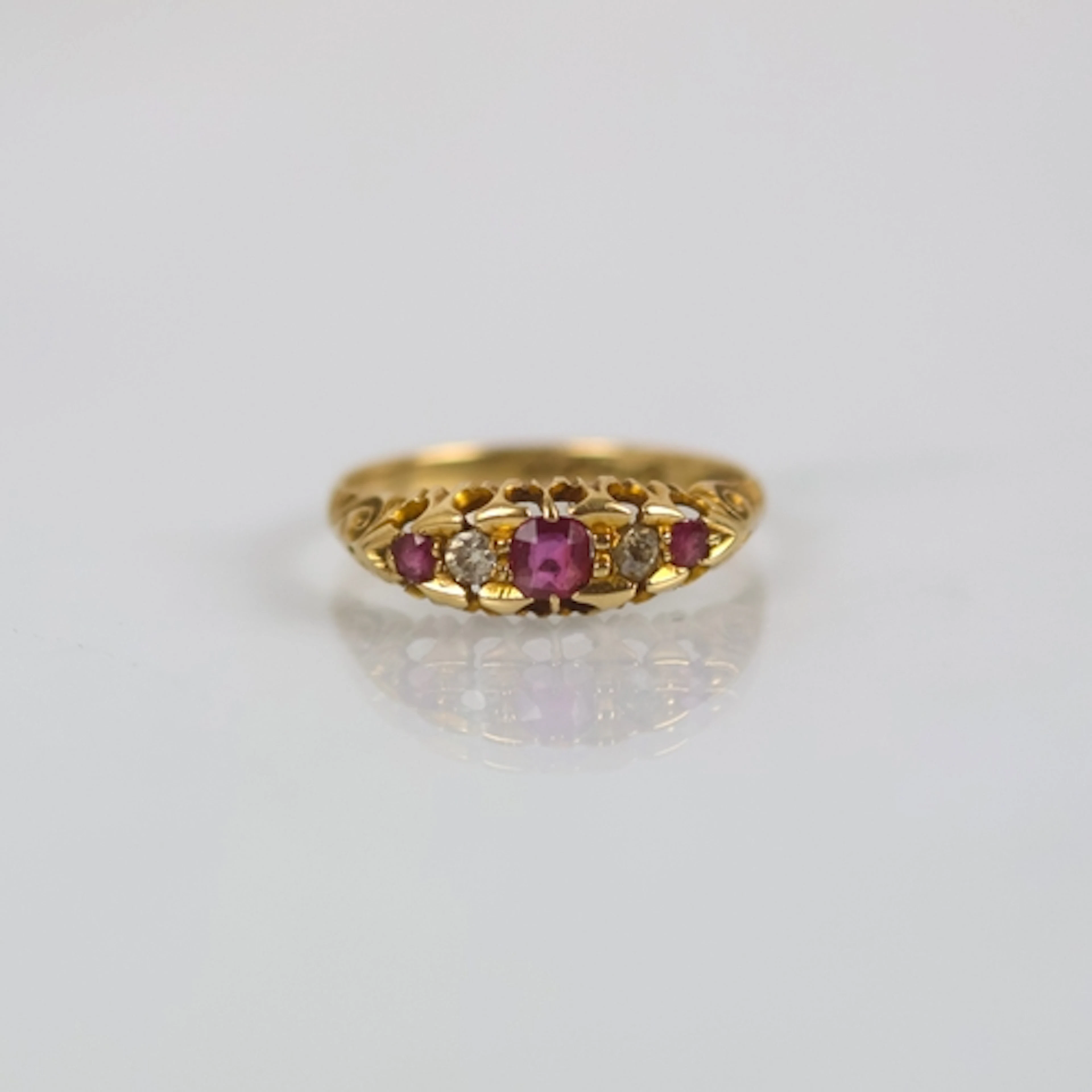 An early 20th century ruby and diamond ring, the central rub...