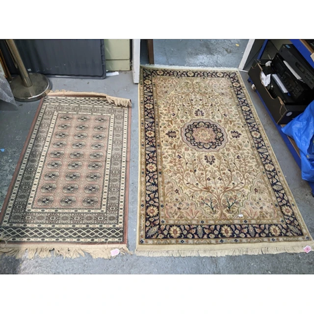 Three rugs to include a Persian, Isfahan style hand woven ru...