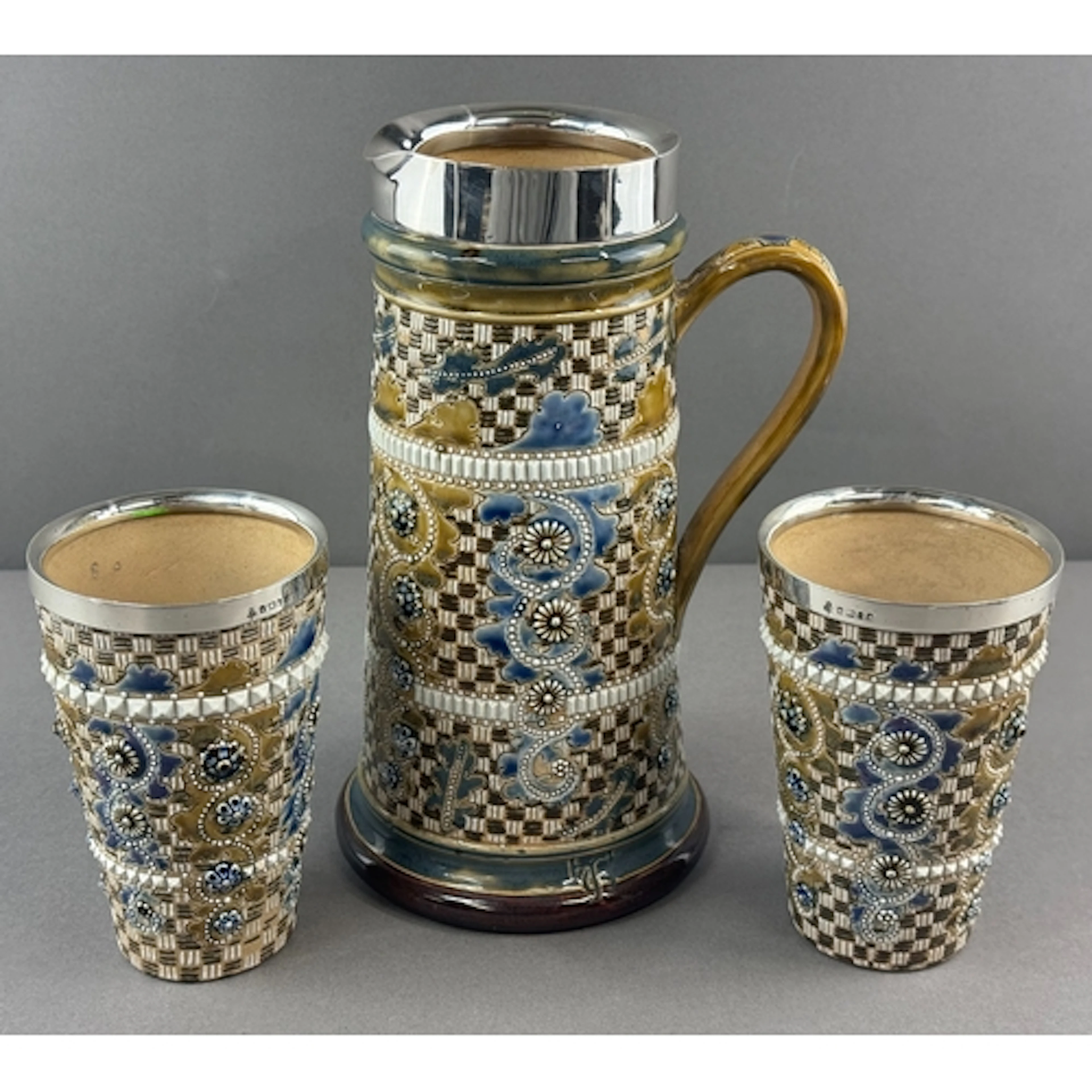 Ceramics: Doulton Lambeth- a silver mounted lemonade jug, Sh...