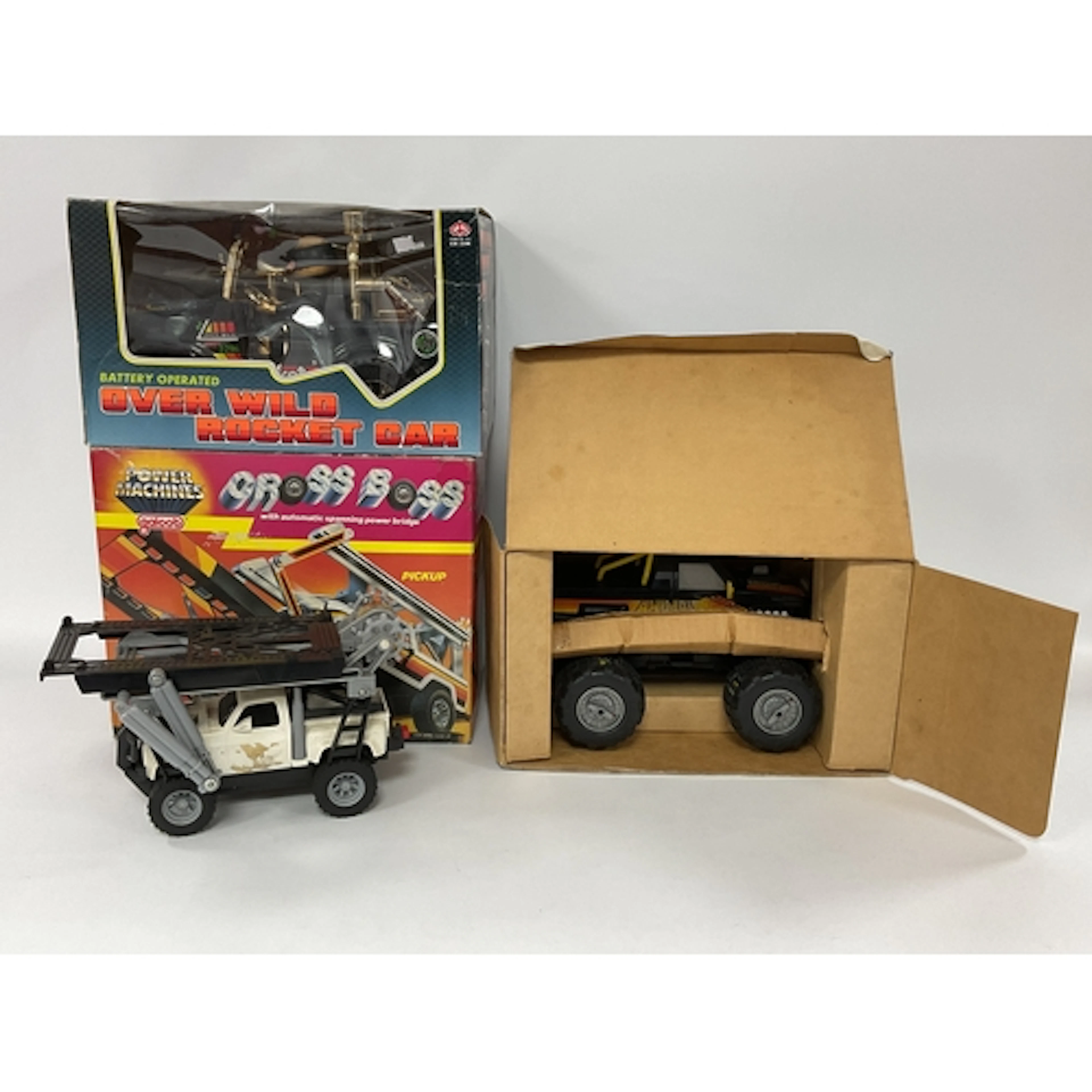 Three Battery Operated Plastic Toy Cars comprising of Galoob...
