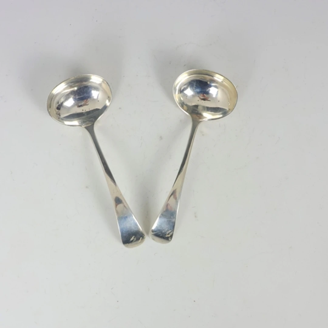 A pair of George V Old English pattern silver sauce ladles, ...