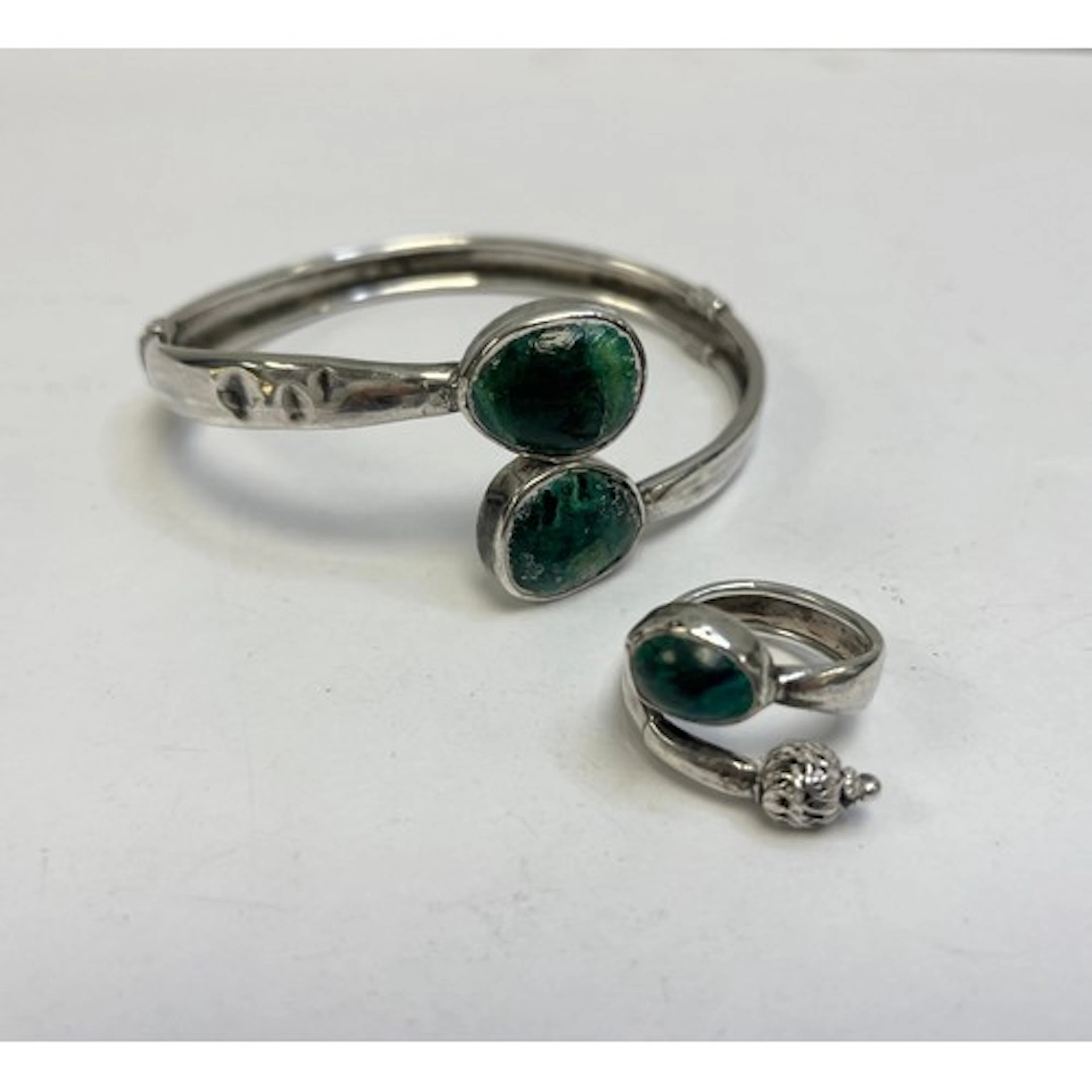 Sterling silver stone set ring with a matching stiff bangle.