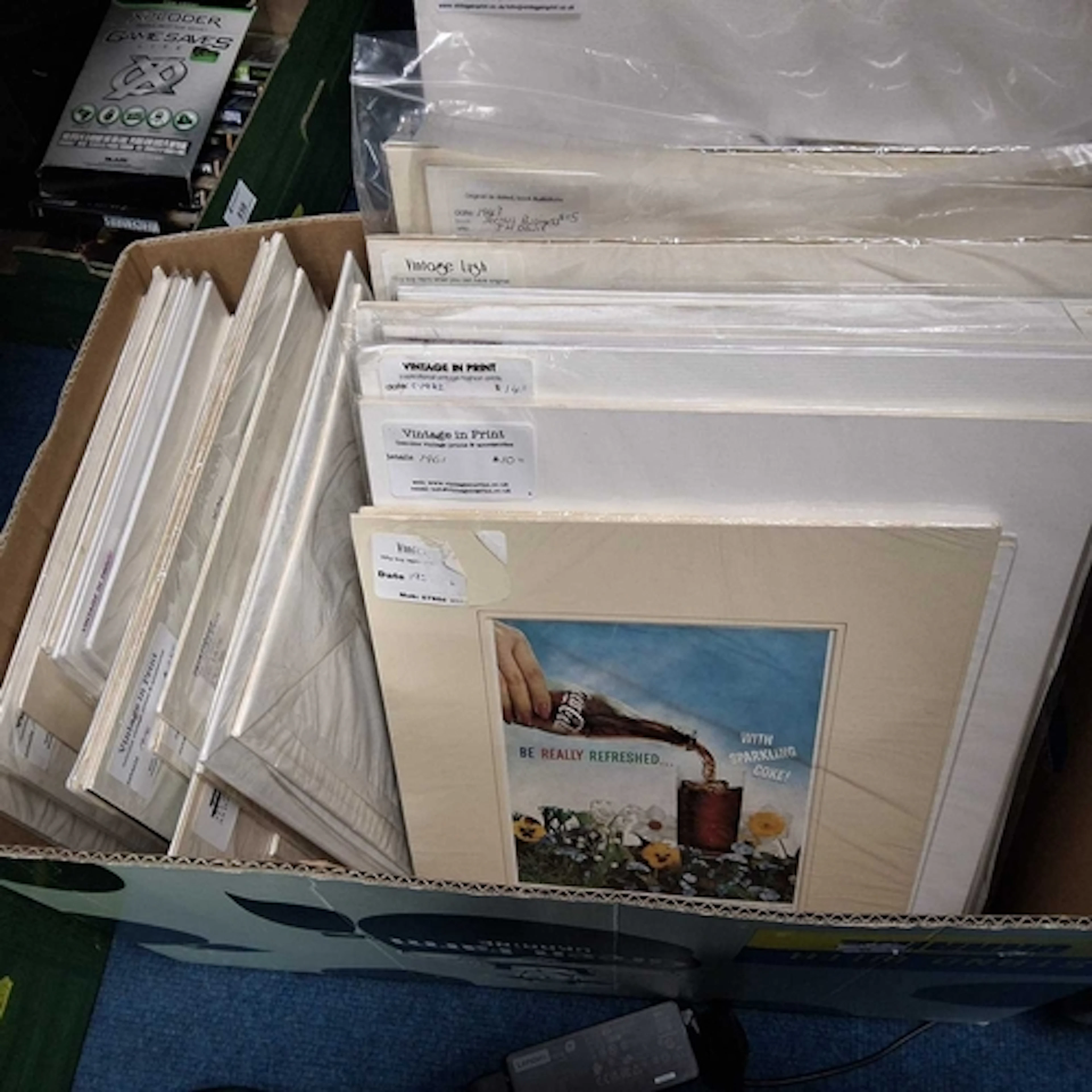ONE BOX OF ASSORTED MOSTLY MOUNTED PRINTS, approximatly one ...