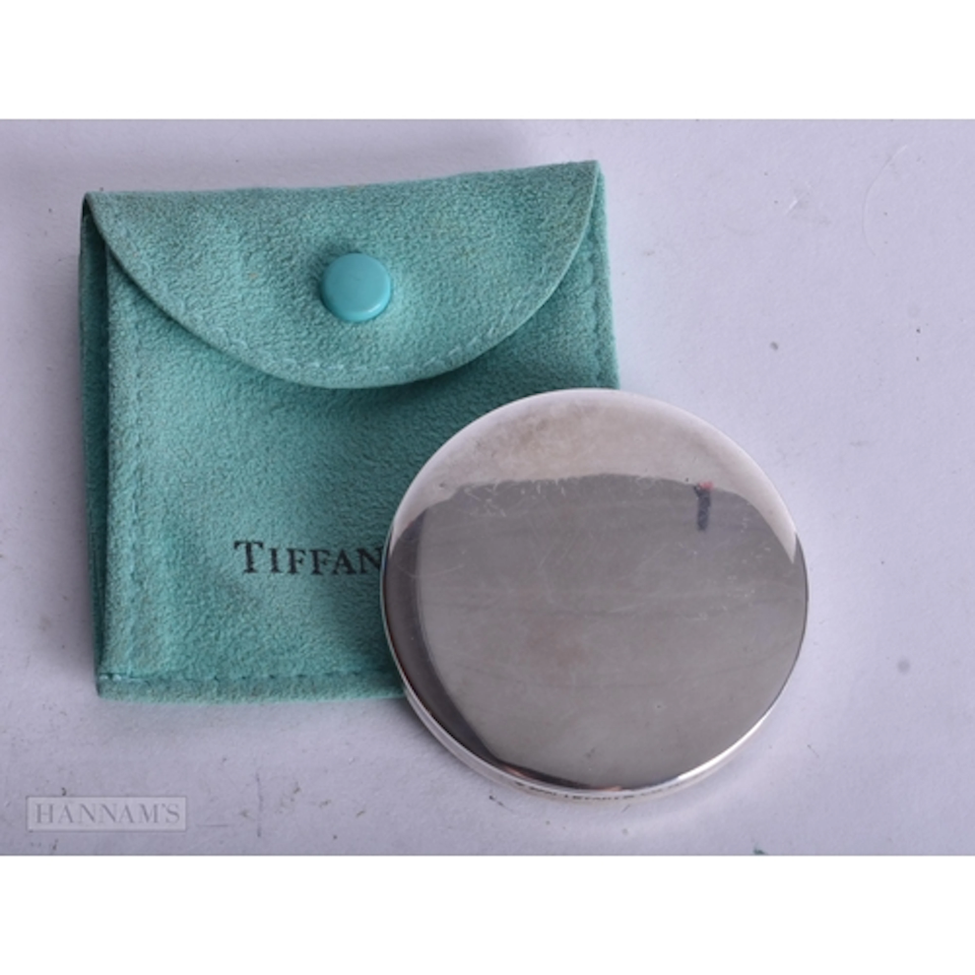 A TIFFANY & CO SILVER MIRROR. 25.7 grams. 5 cm wide.
