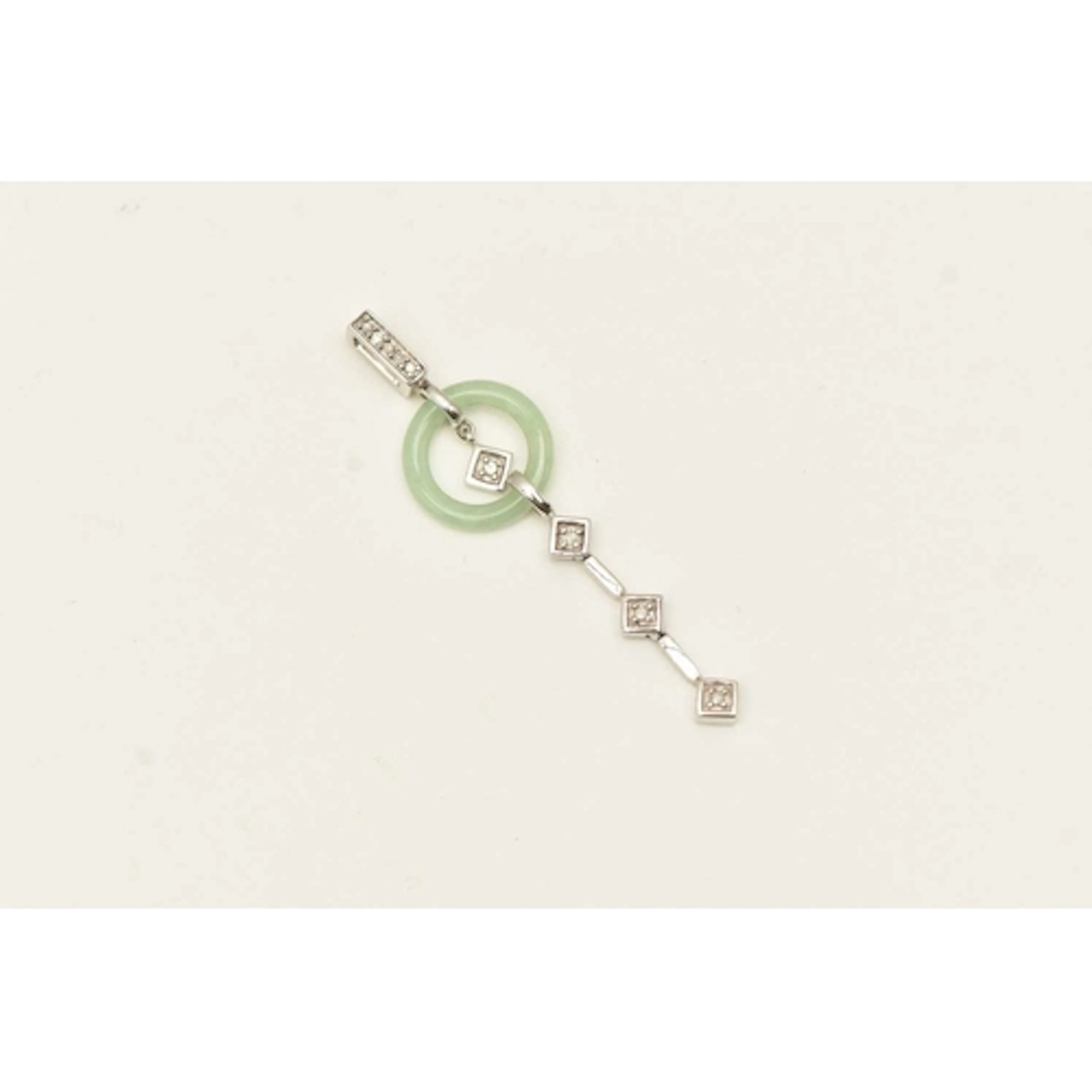 A 9CT WHITE GOLD PENDANT, a white gold drop pendant fitted w...