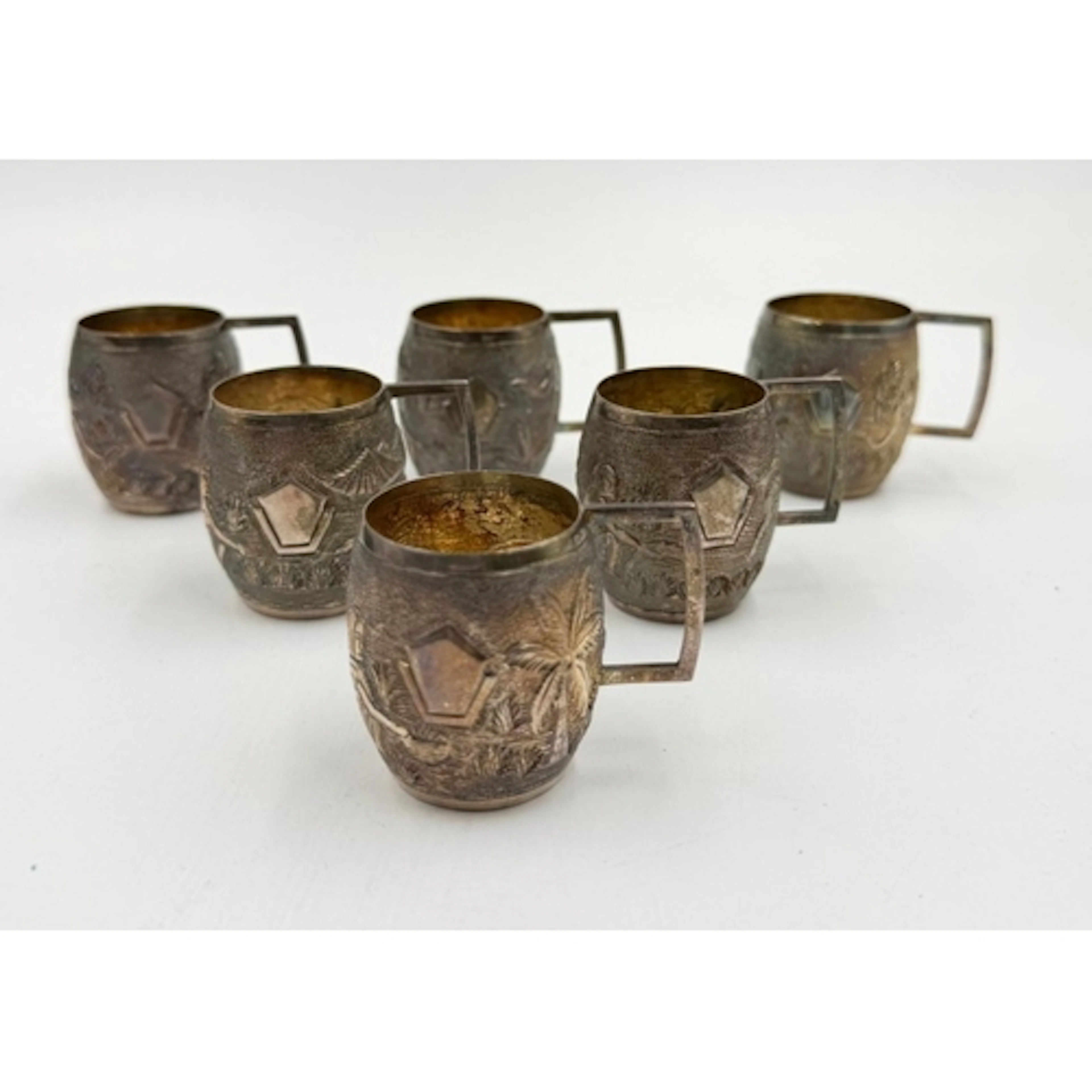 A set of six Sterling silver miniature tankards with Indian ...