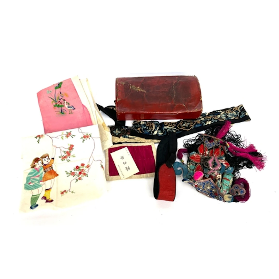 An early 20th century Chinese red lacquered leather box open...