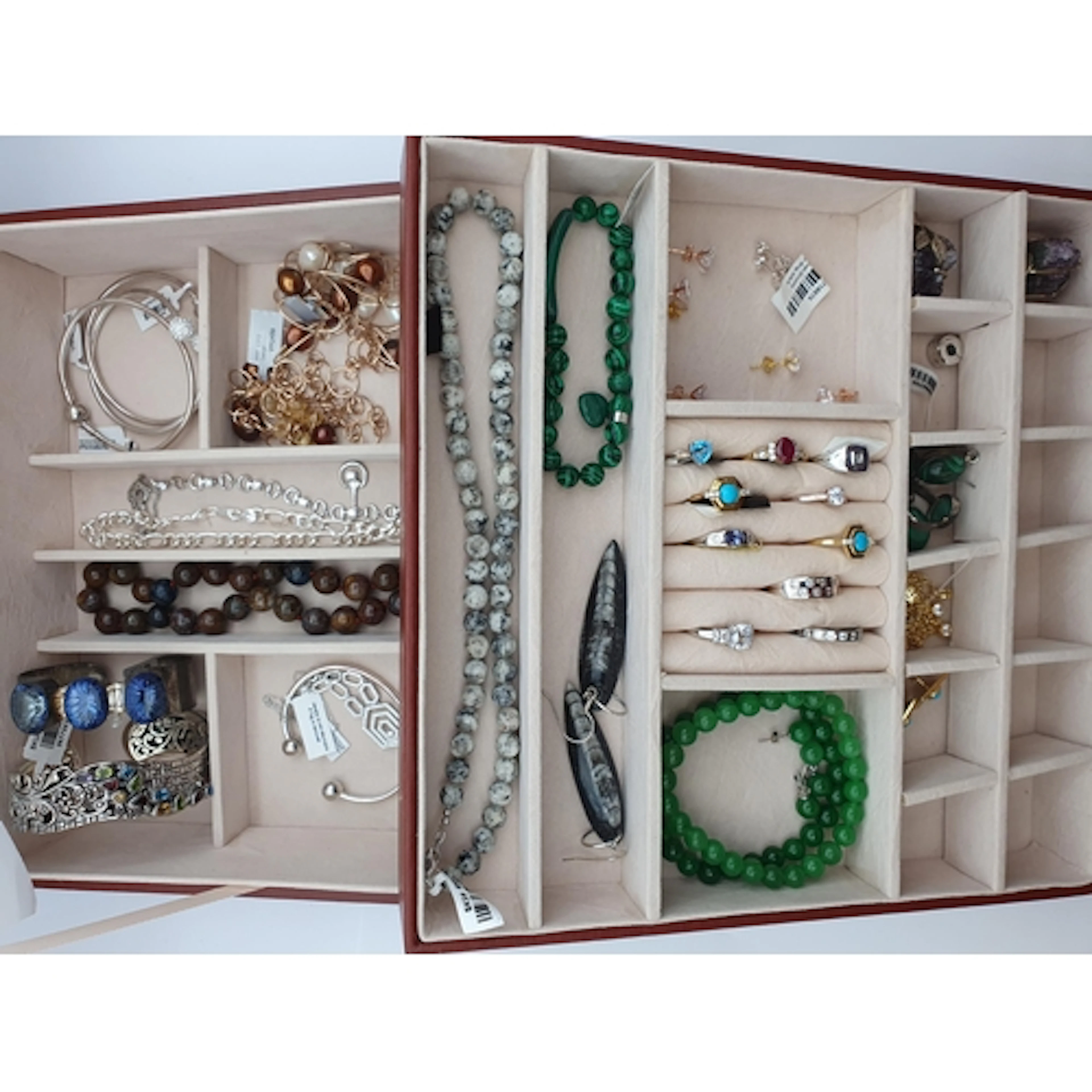 A tan Jewel Box containing Rings stamped 925 set various sto...