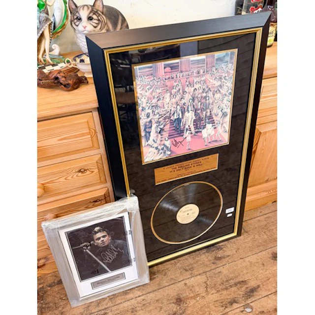 A framed Rolling Stones presentation signed album "It's Only...
