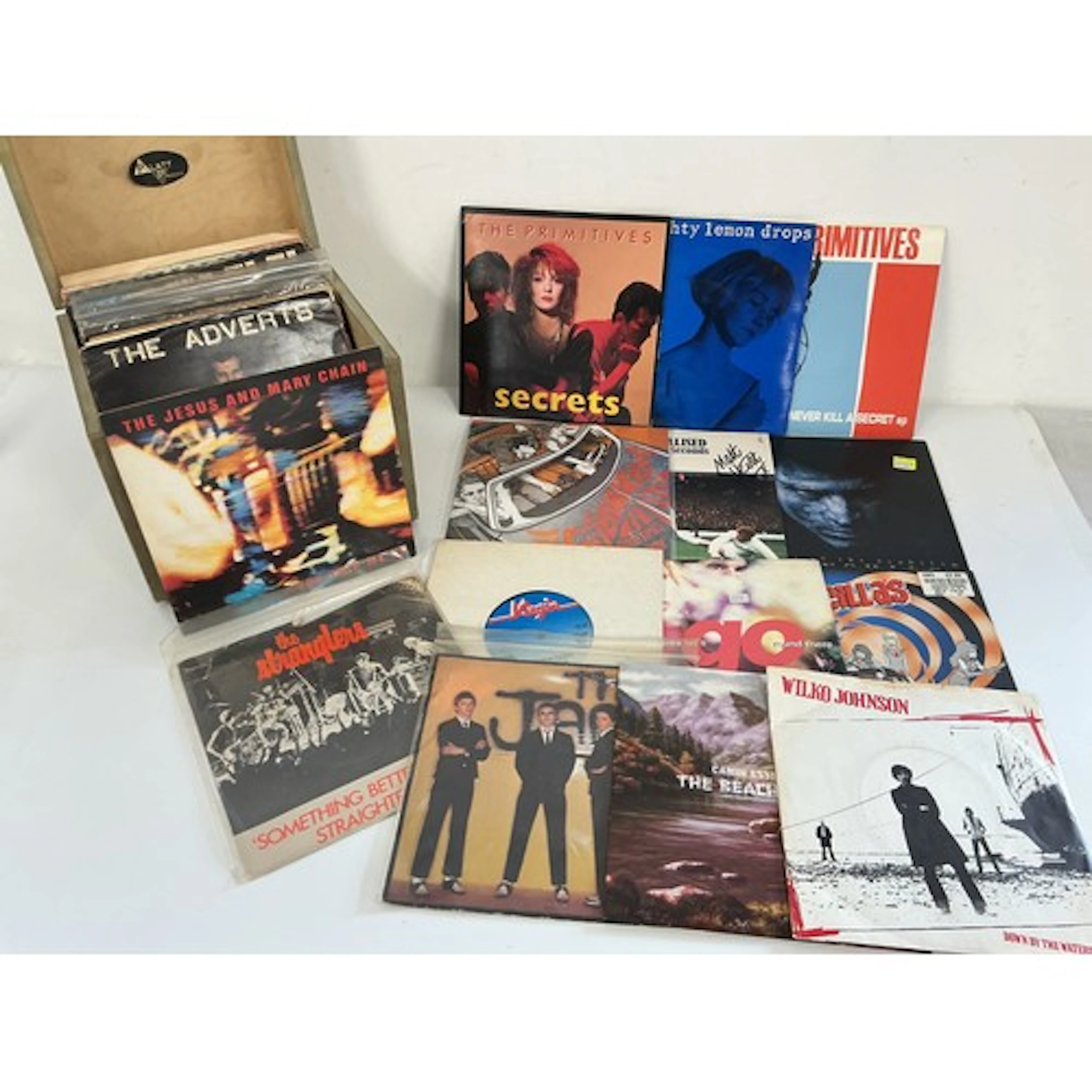 A record case of 7” singles and EPs by various artists inclu...