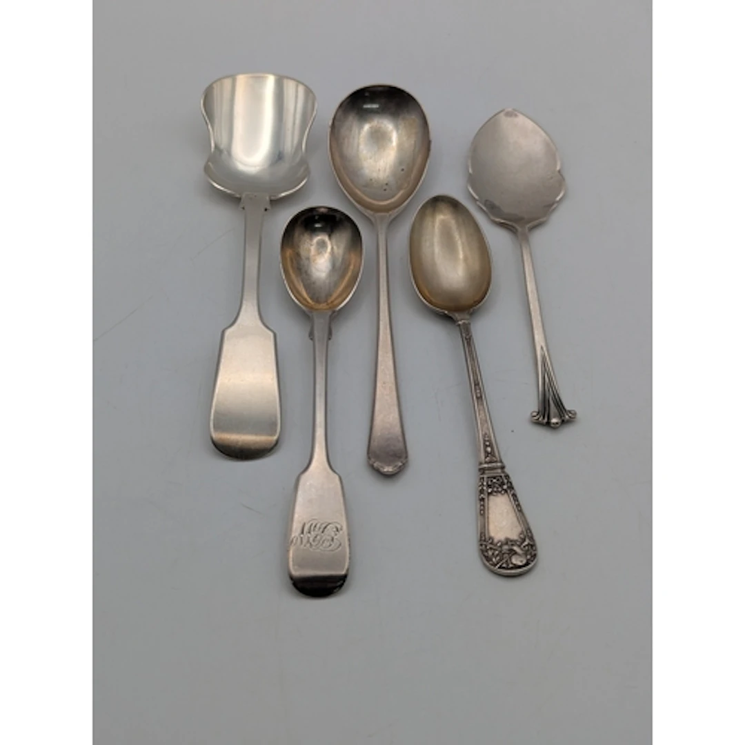Five silver spoons to include a fiddle pattern preserve spoo...