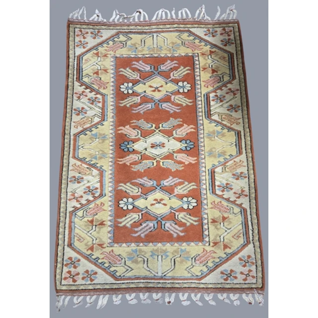 A good Turkish cream ground Rug with repeating aztech design...