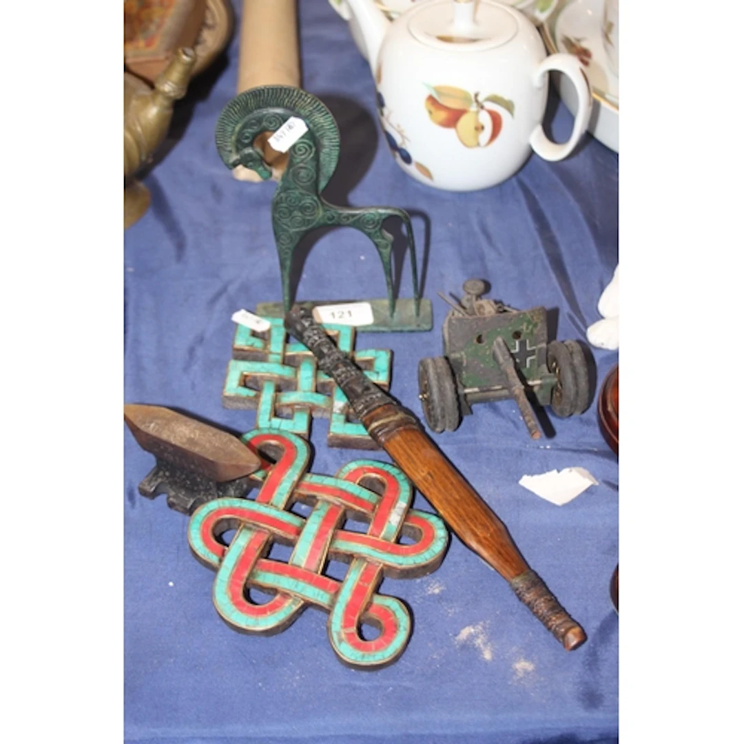 Miniature anvil, knife, wall plaques, toy cannon.