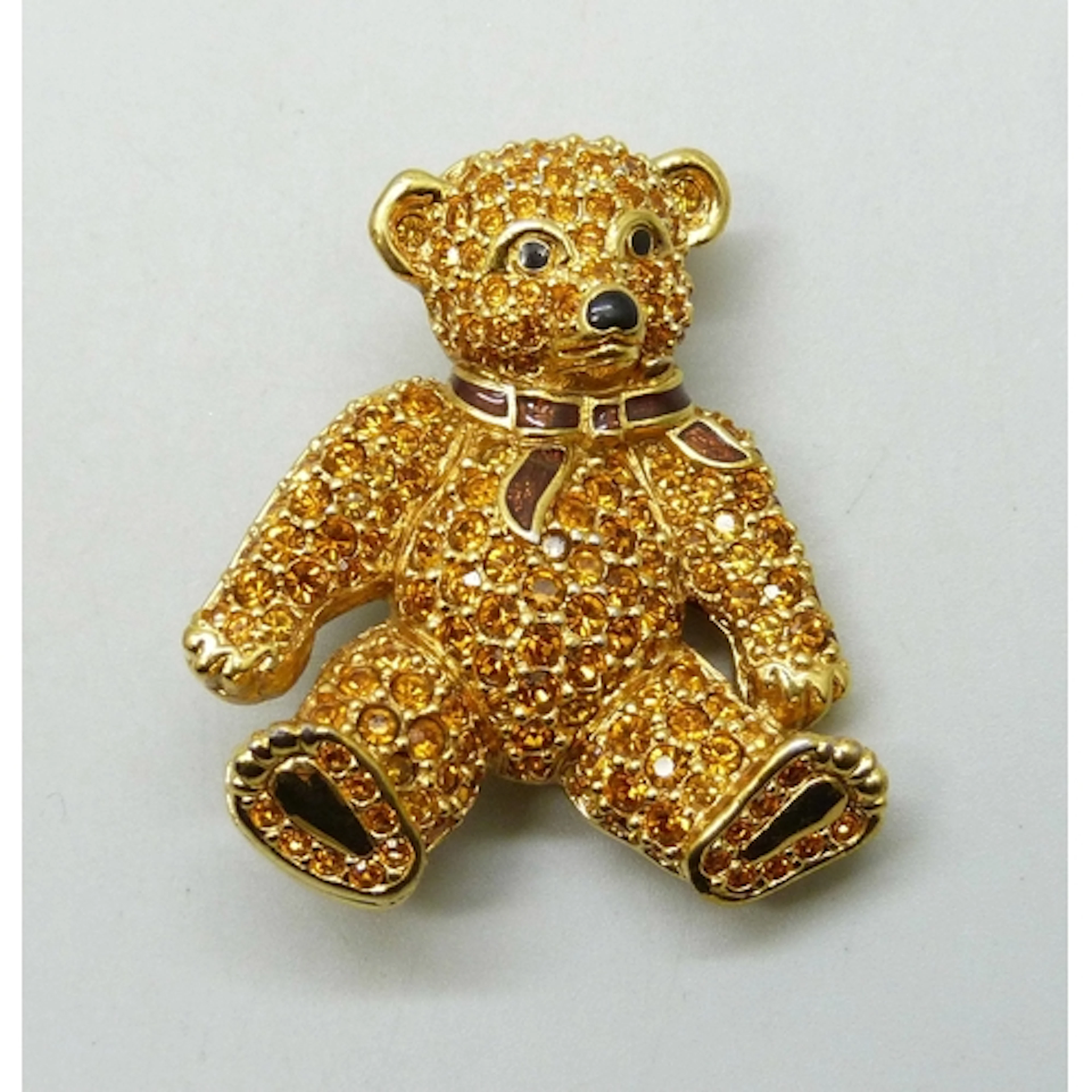 A Swarovski enamel and stone set bear brooch, 4cm