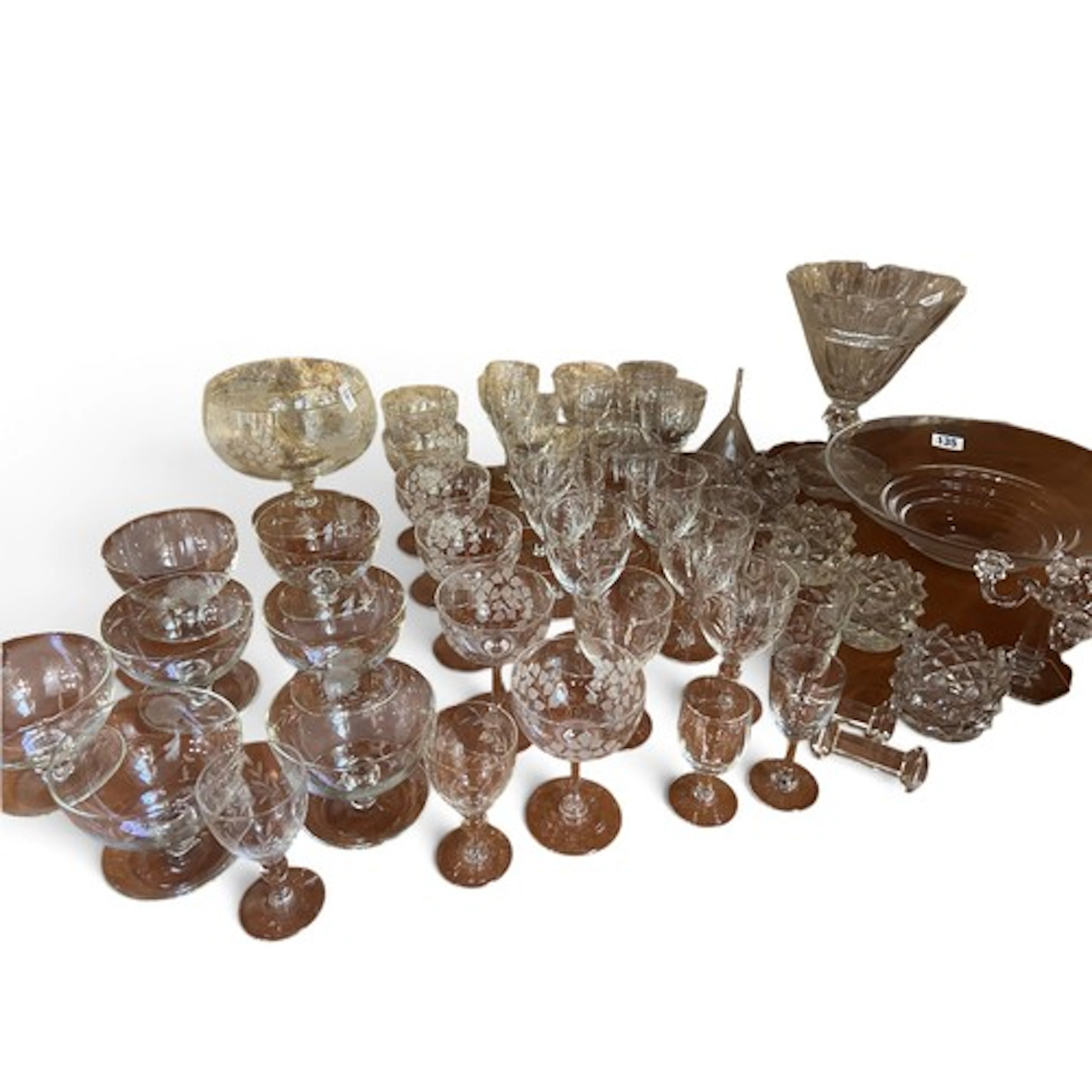 A collection of etched, cut and coloured glass to include wi...