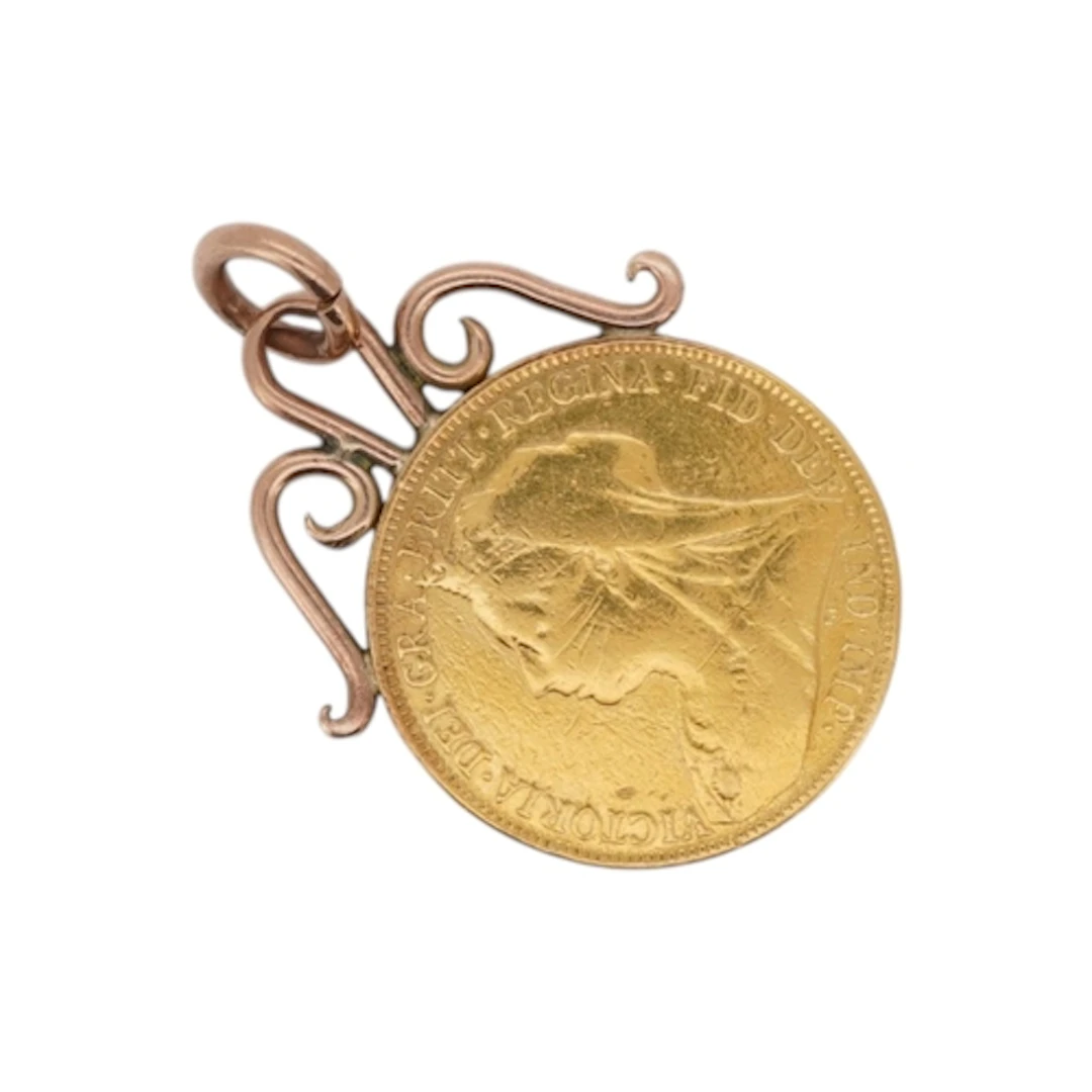 A Victoria 1901 gold sovereign, set in a later yellow metal ...