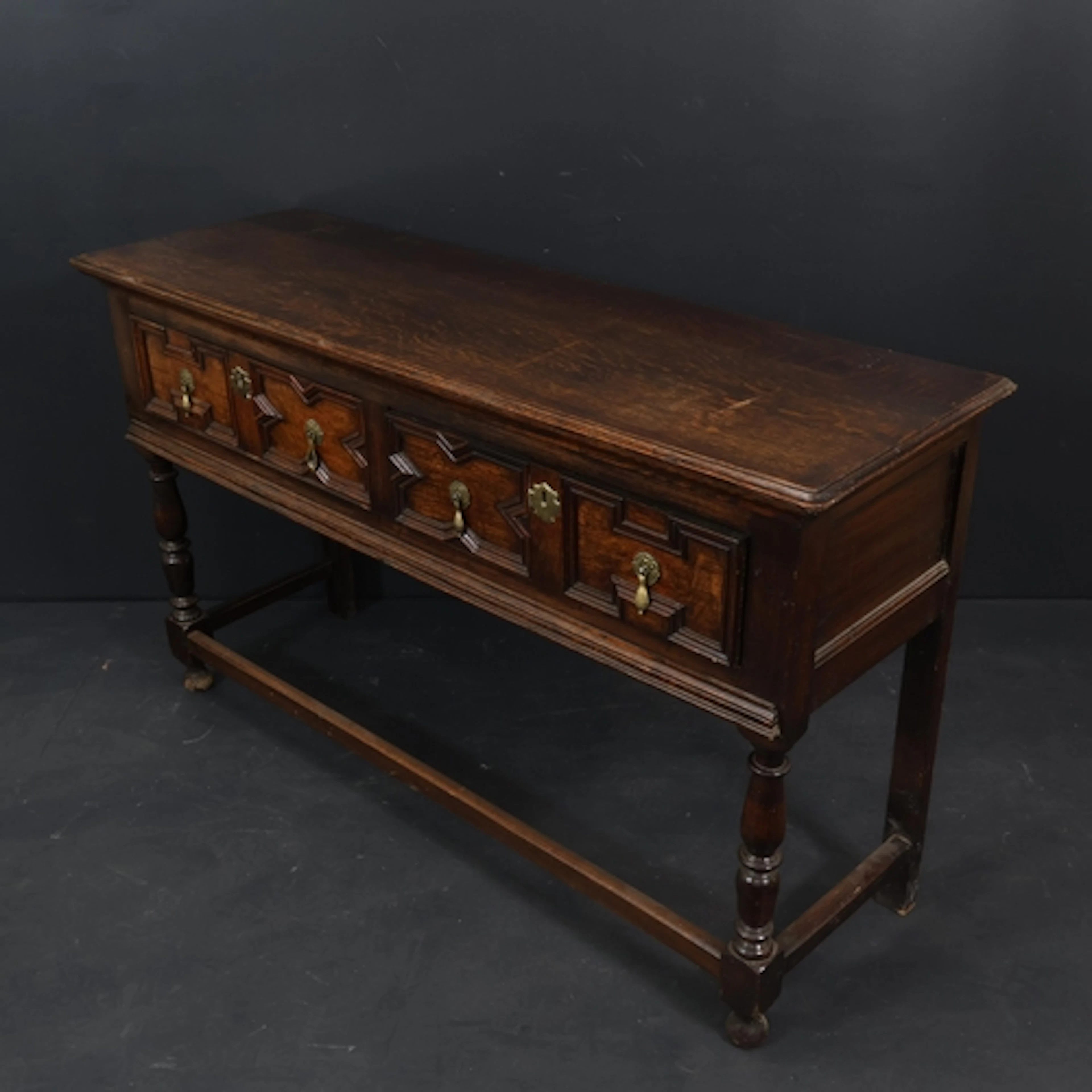 A small early 20th century oak 2-drawer dresser base in Caro...