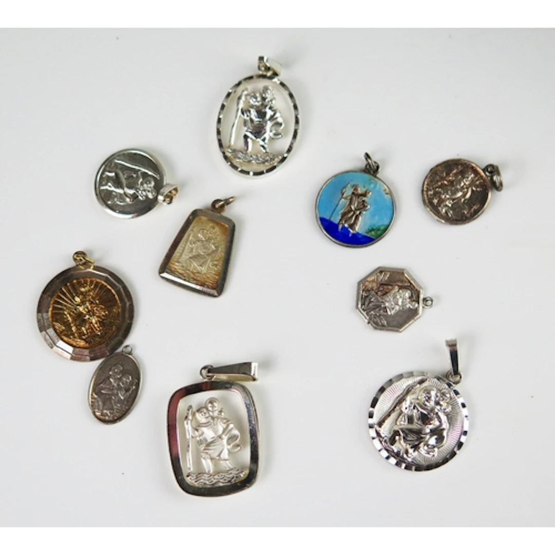 Ten silver St. Christopher pendants, 28.9g