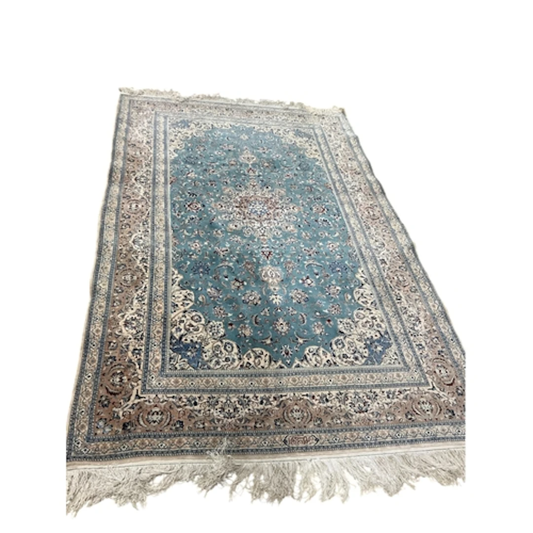 A North West Persian part silk cream ground carpet, 272 x 17...