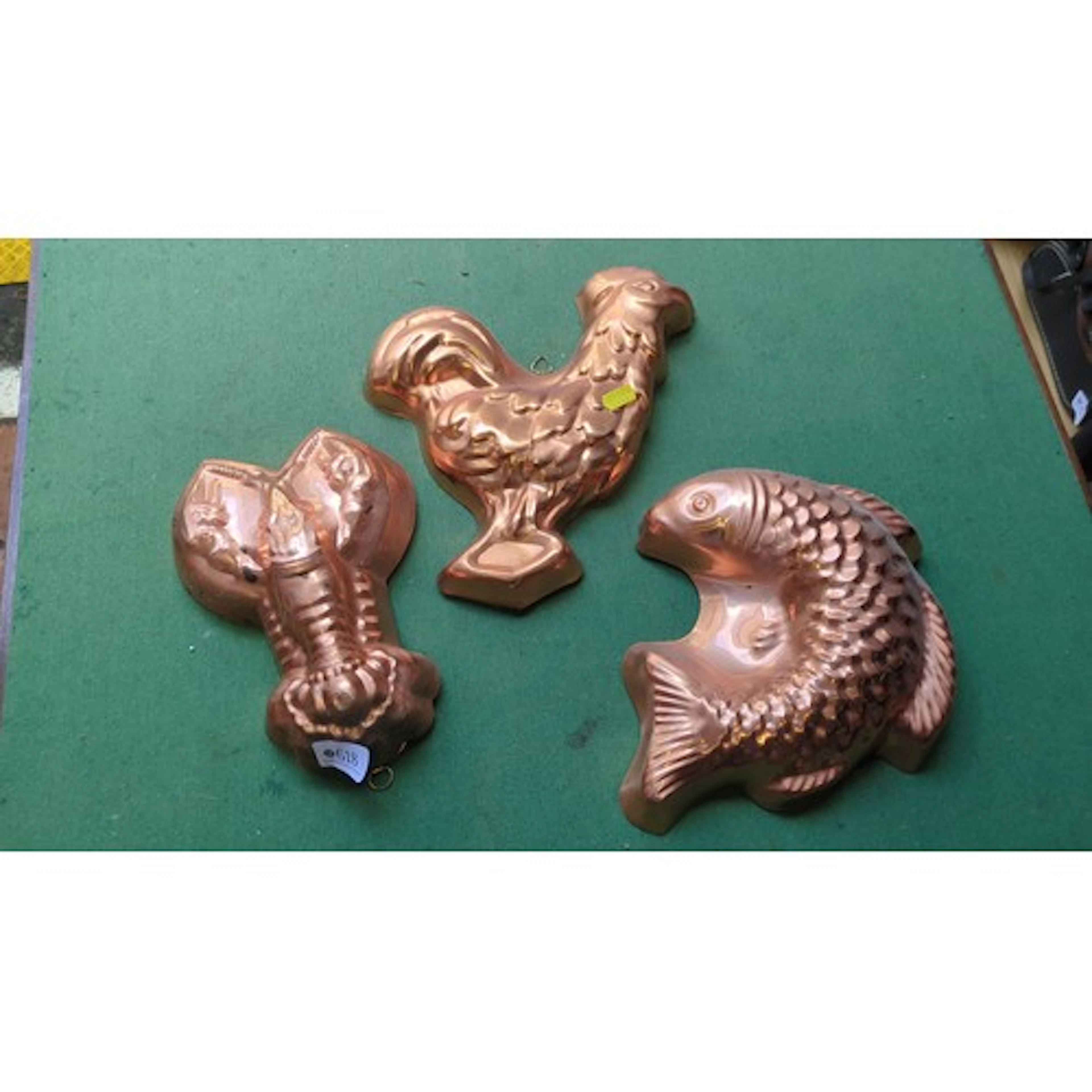 A group of three moulded copper and tinned-metal culinary je...