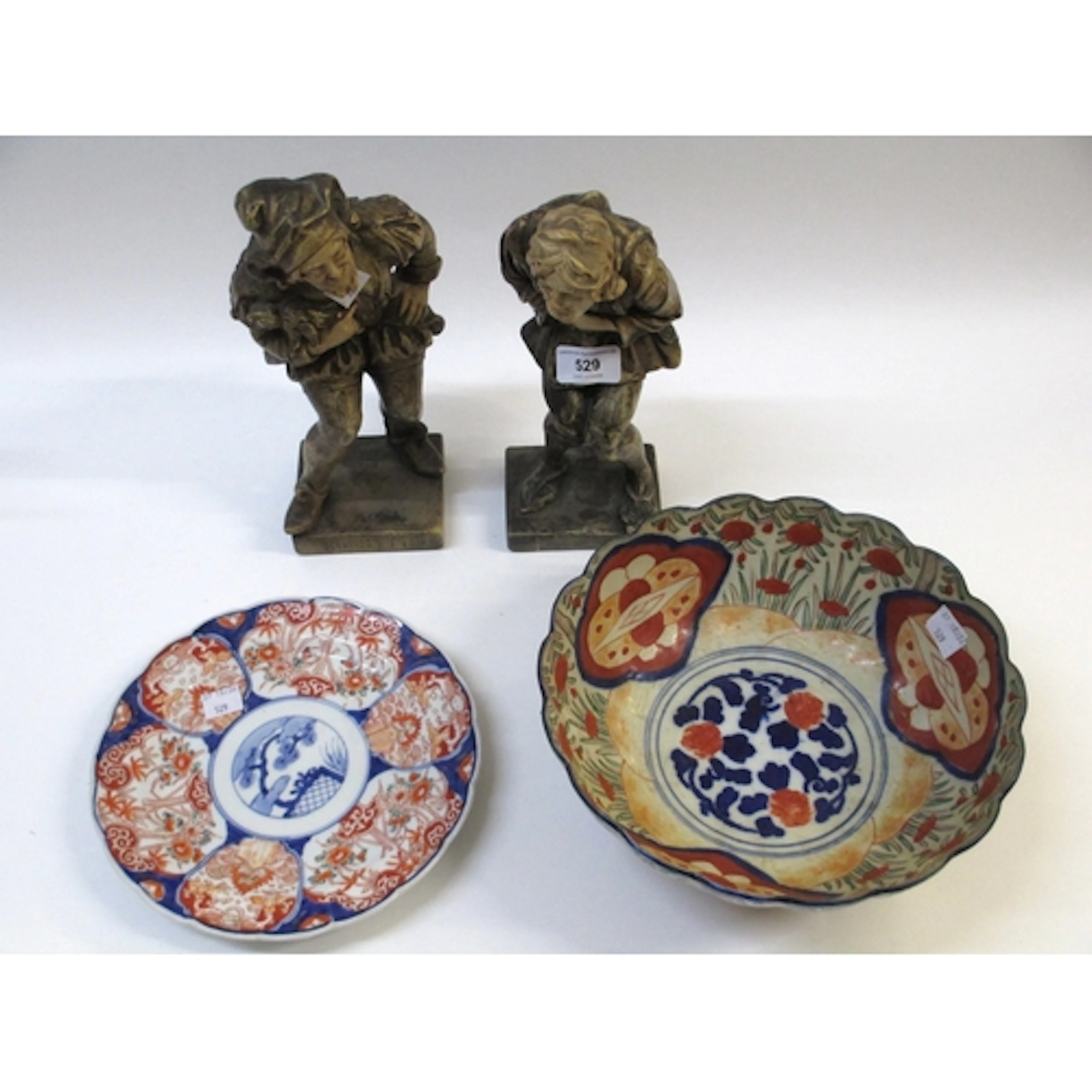 Plaster figure of a jester, inscribed Rigoletto, and another...