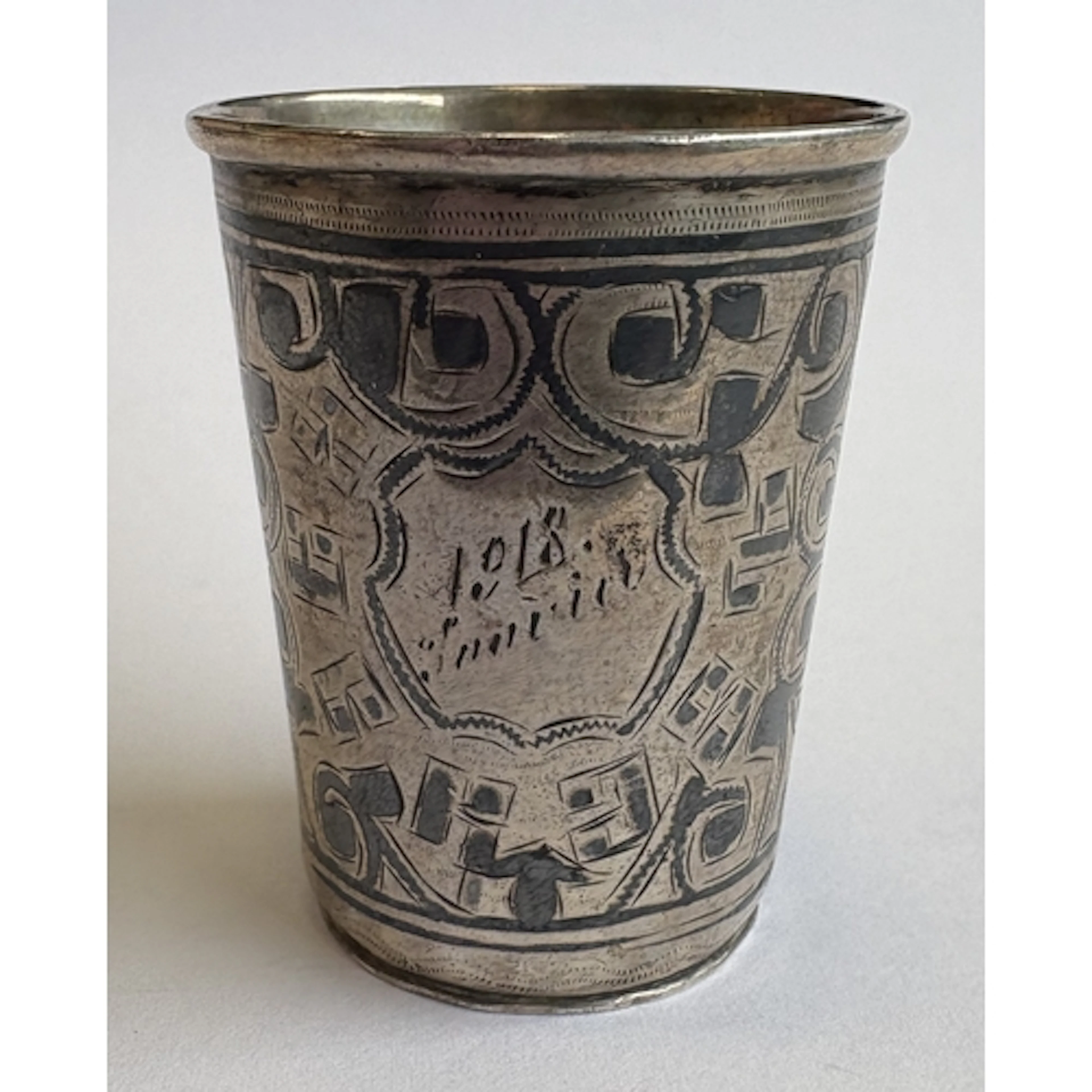 A Russian silver and niello shot cup, marked 84 to base. By ...