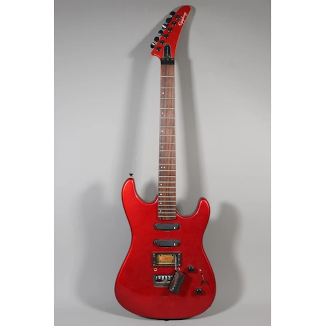 Gibson Epiphone electric guitar with red finish.