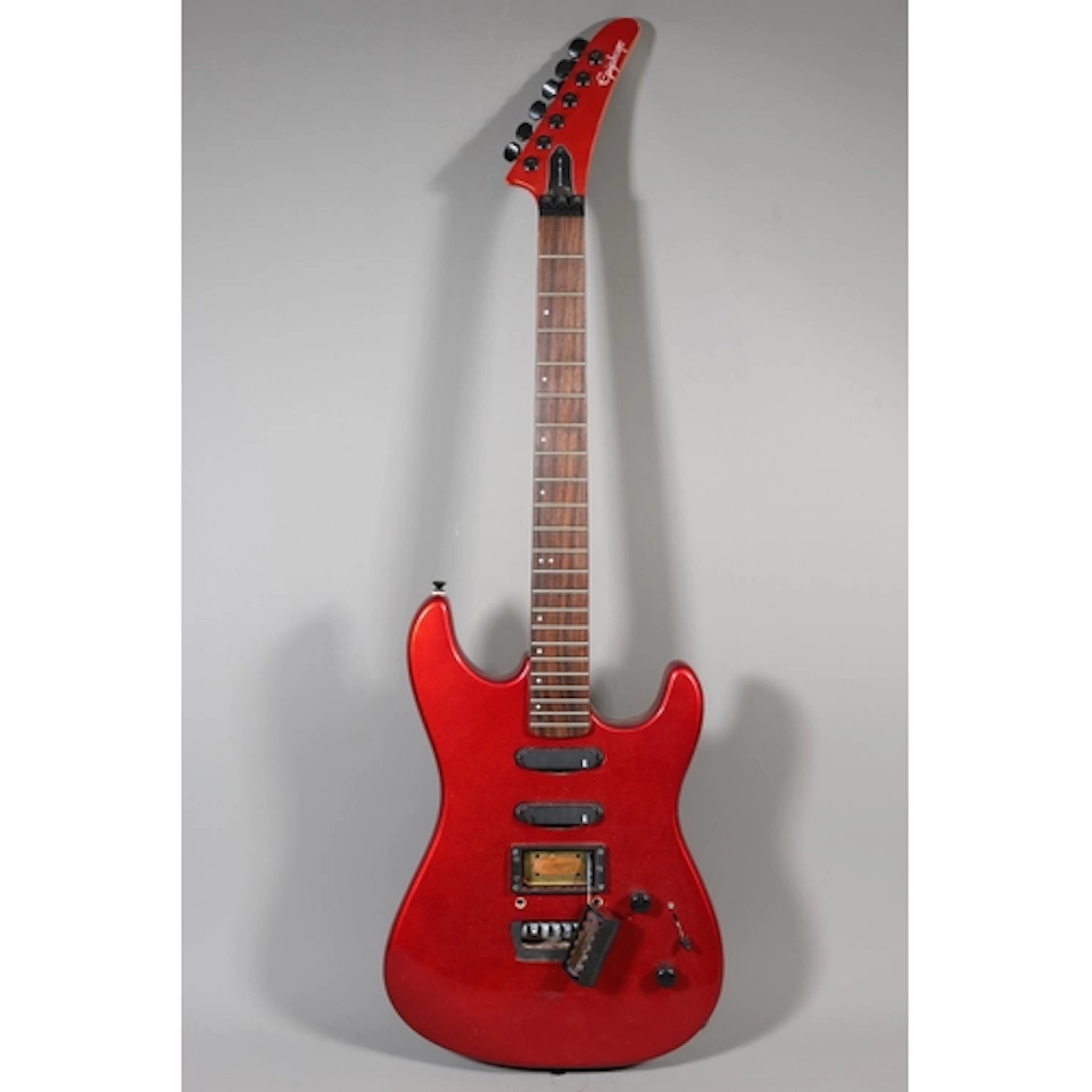 Gibson Epiphone electric guitar with red finish.