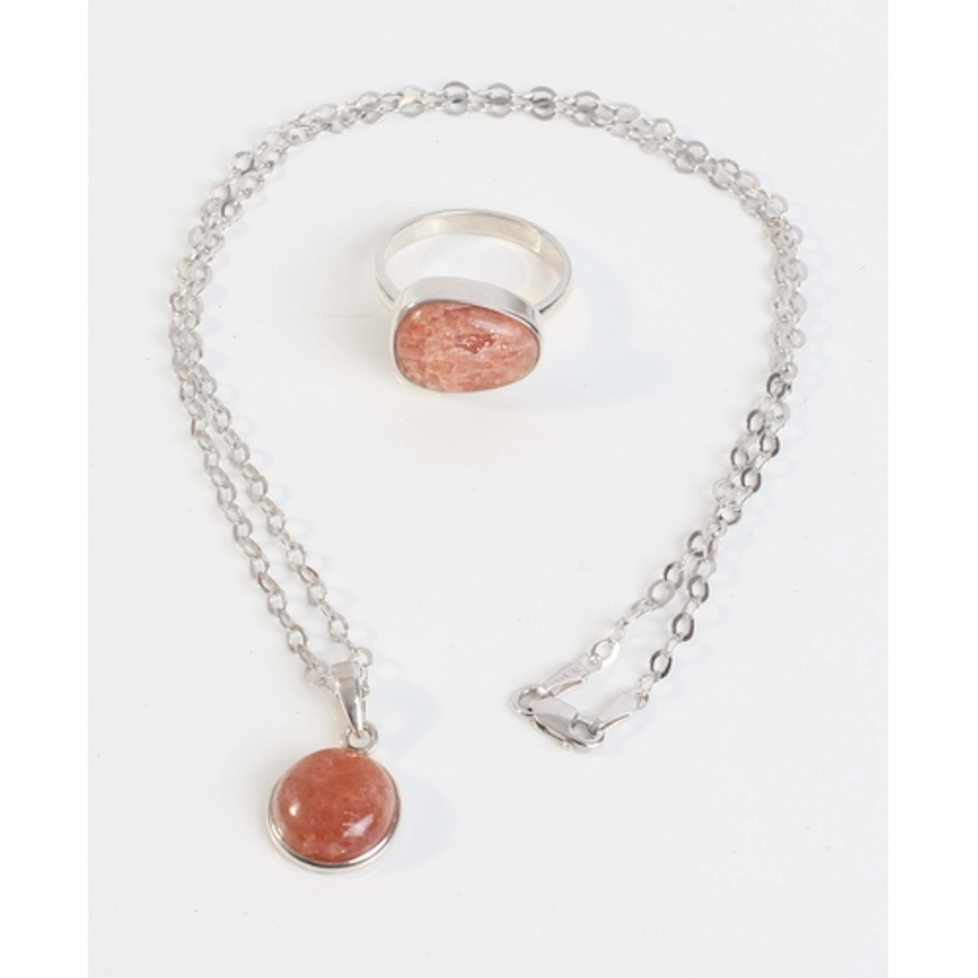 A sterling silver and Pana Sunstone ring and matching pendan...