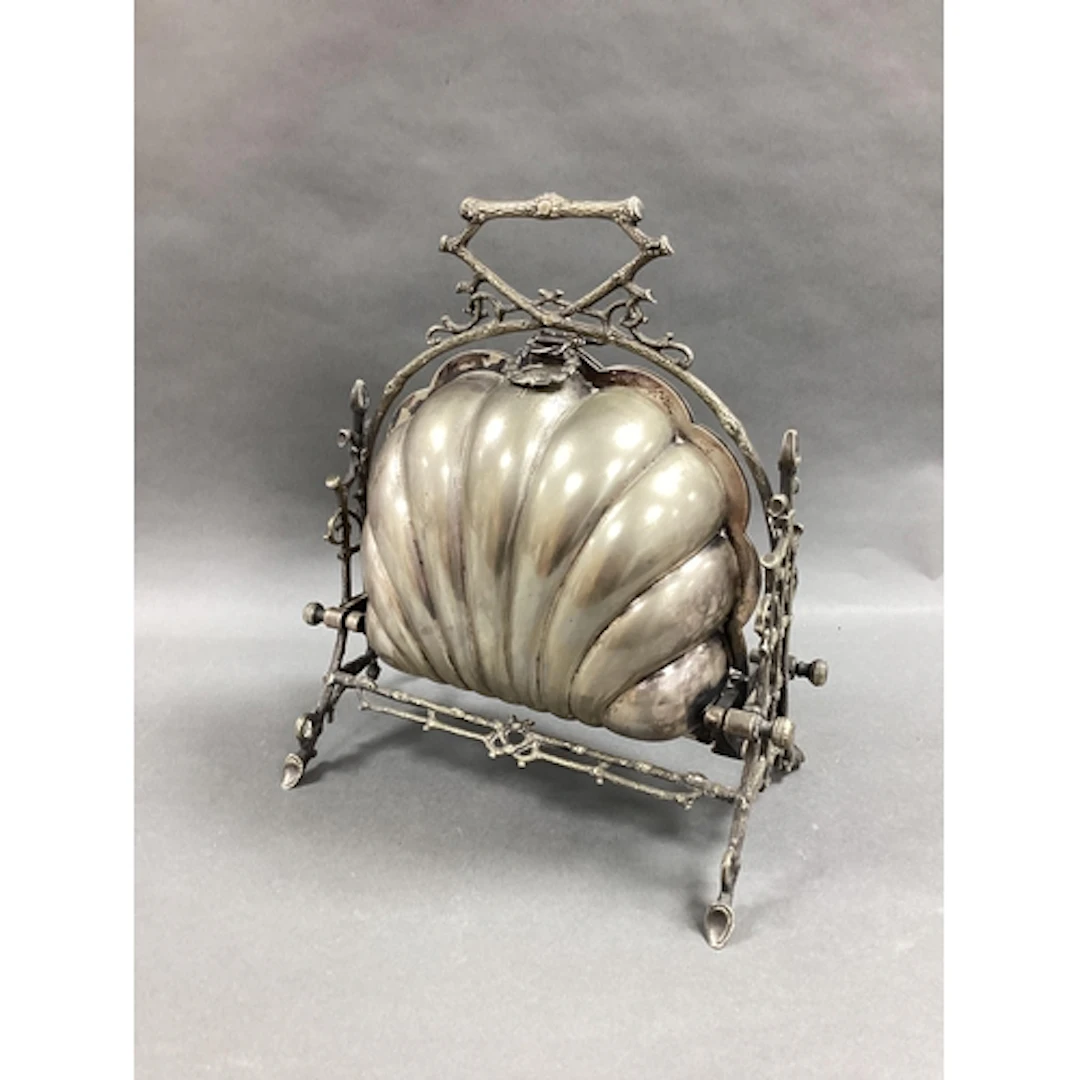 A Victorian Plated Clam Shell Style Muffin Warmer, with laur...