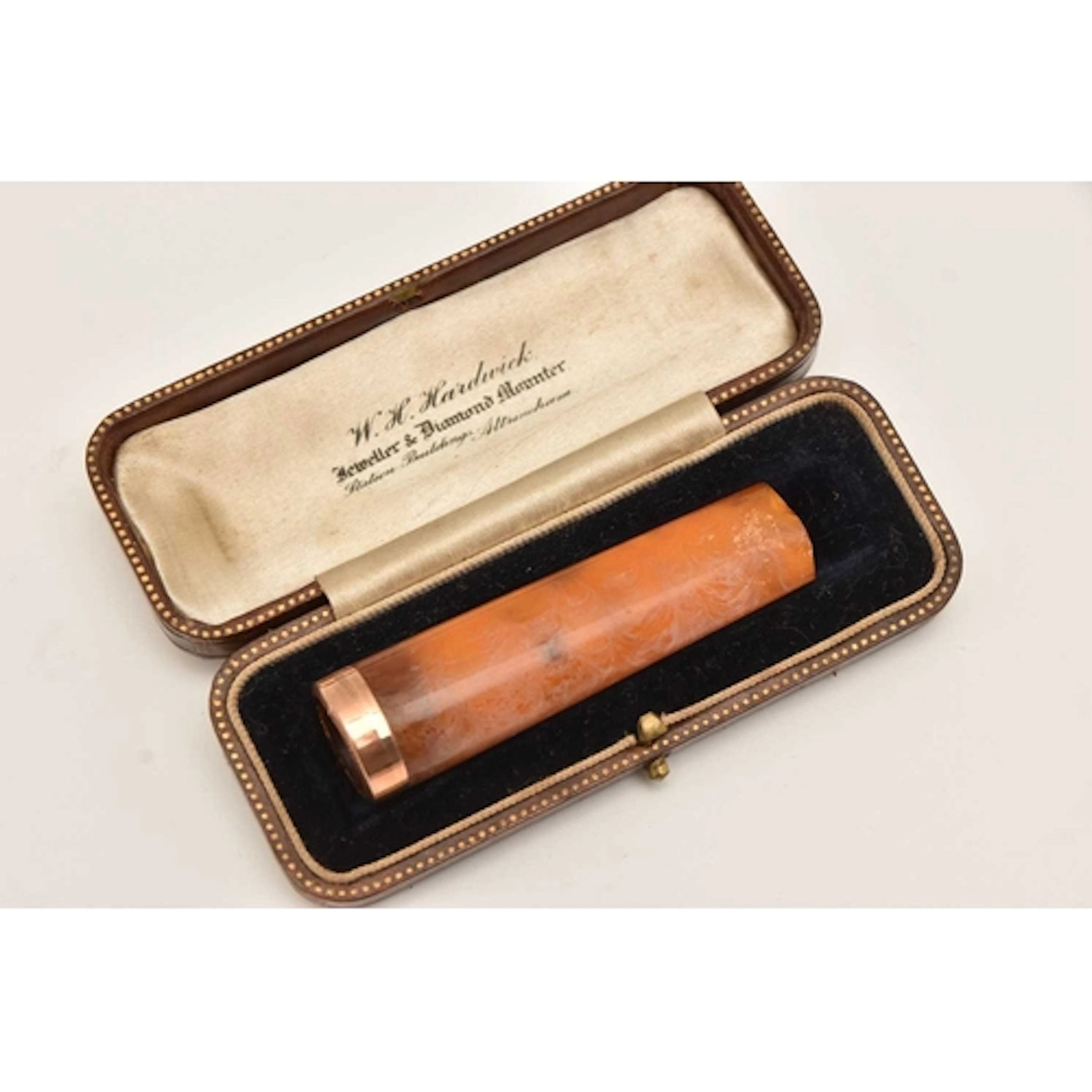 A 9CT GOLD RIMMED CHEROOT, approximate length 66mm, together...